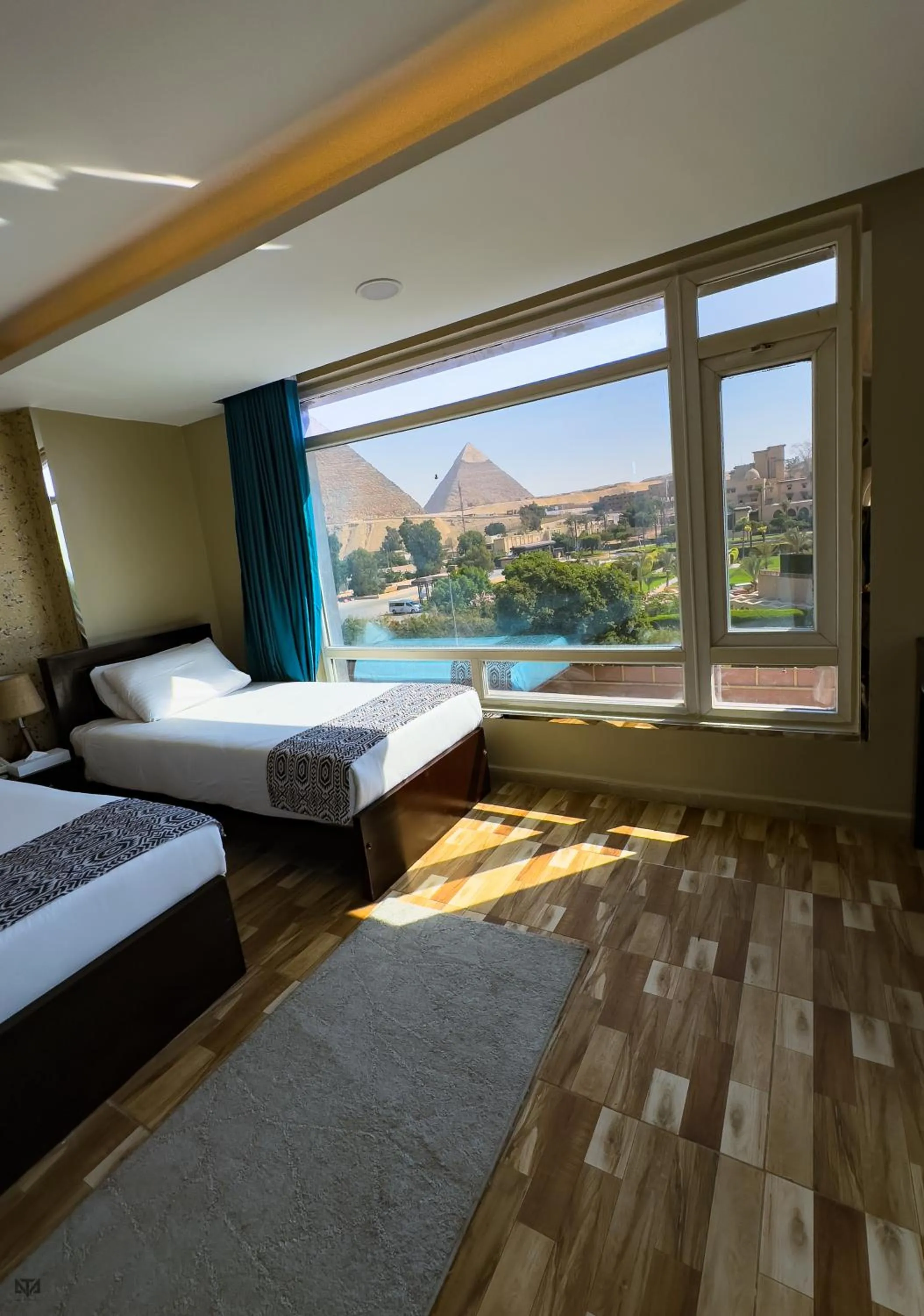 Bed in Turquoise Pyramids & Grand Egyptian museum view Hotel