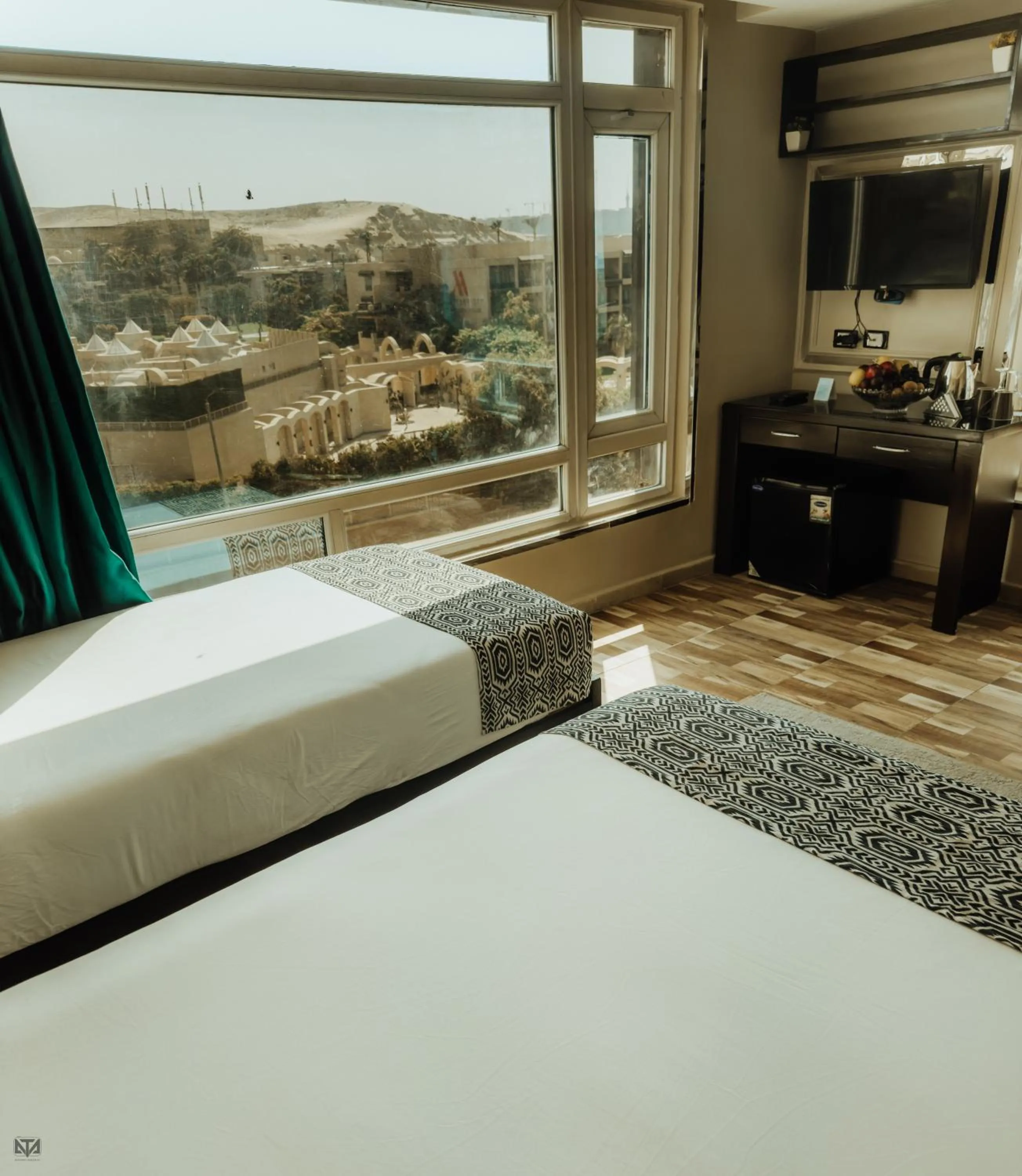 Bed in Turquoise Pyramids & Grand Egyptian museum view Hotel