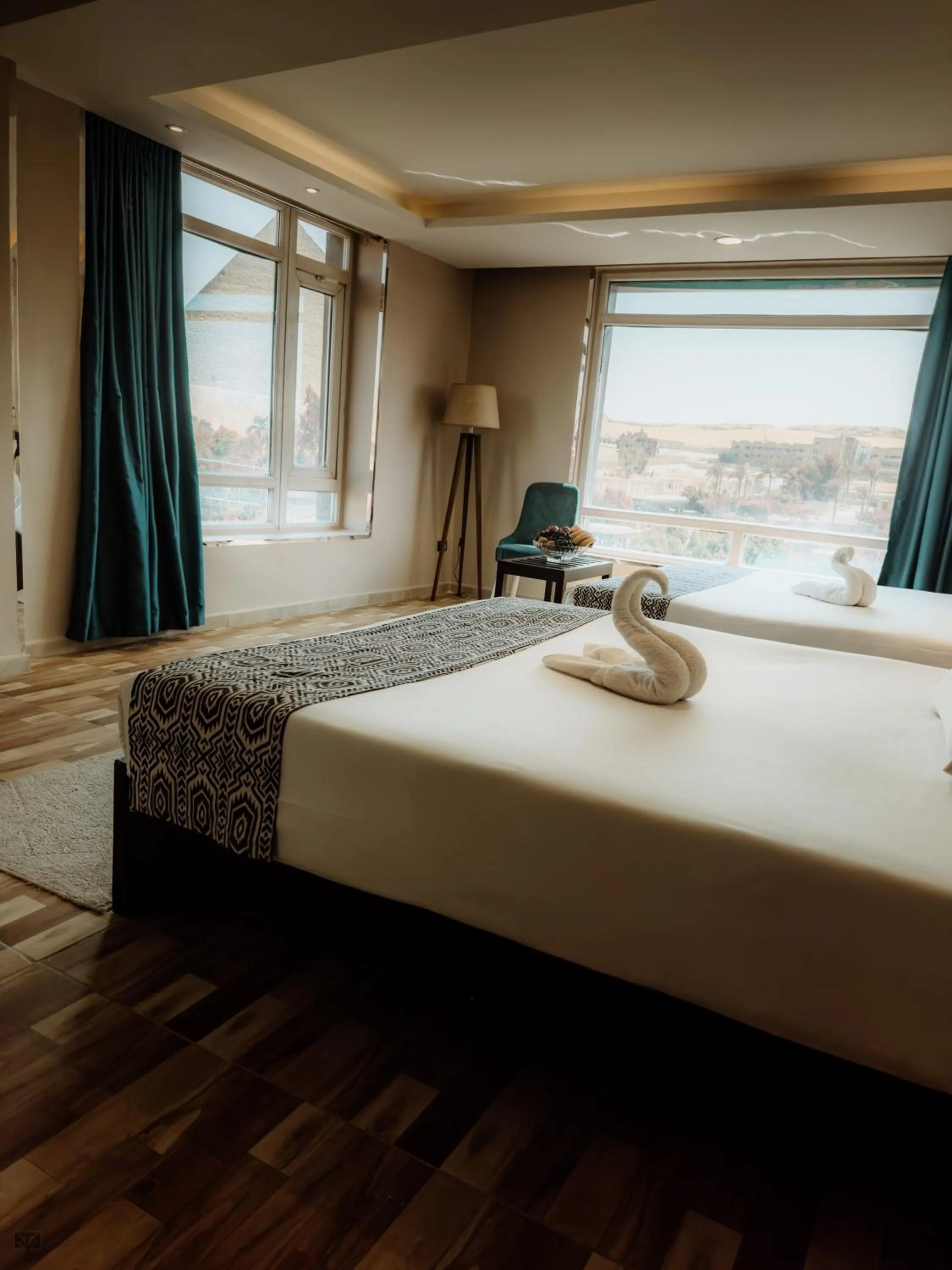 Bed in Turquoise Pyramids & Grand Egyptian museum view Hotel