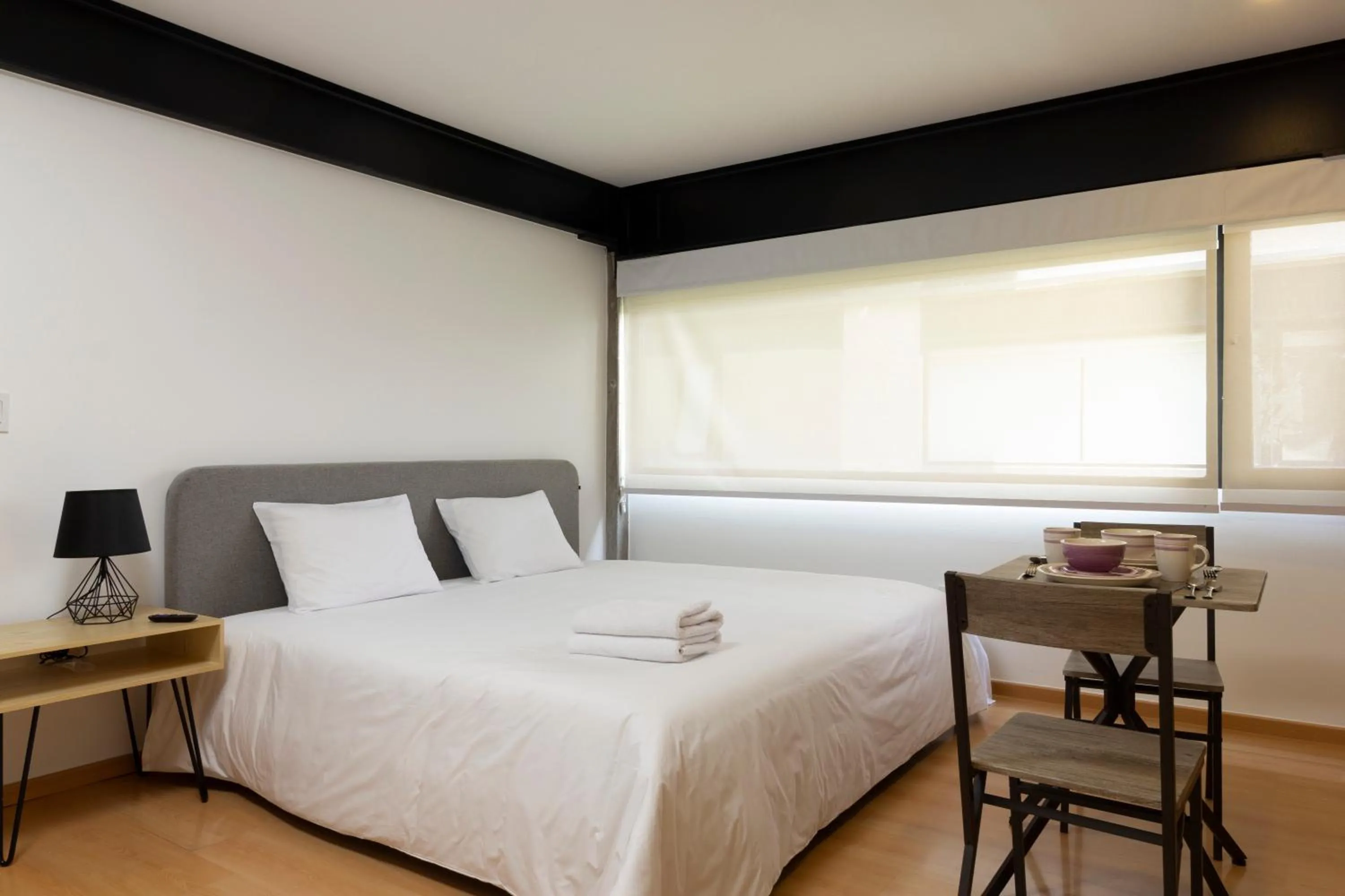 Photo of the whole room, Bed in El Doce by HomiRent