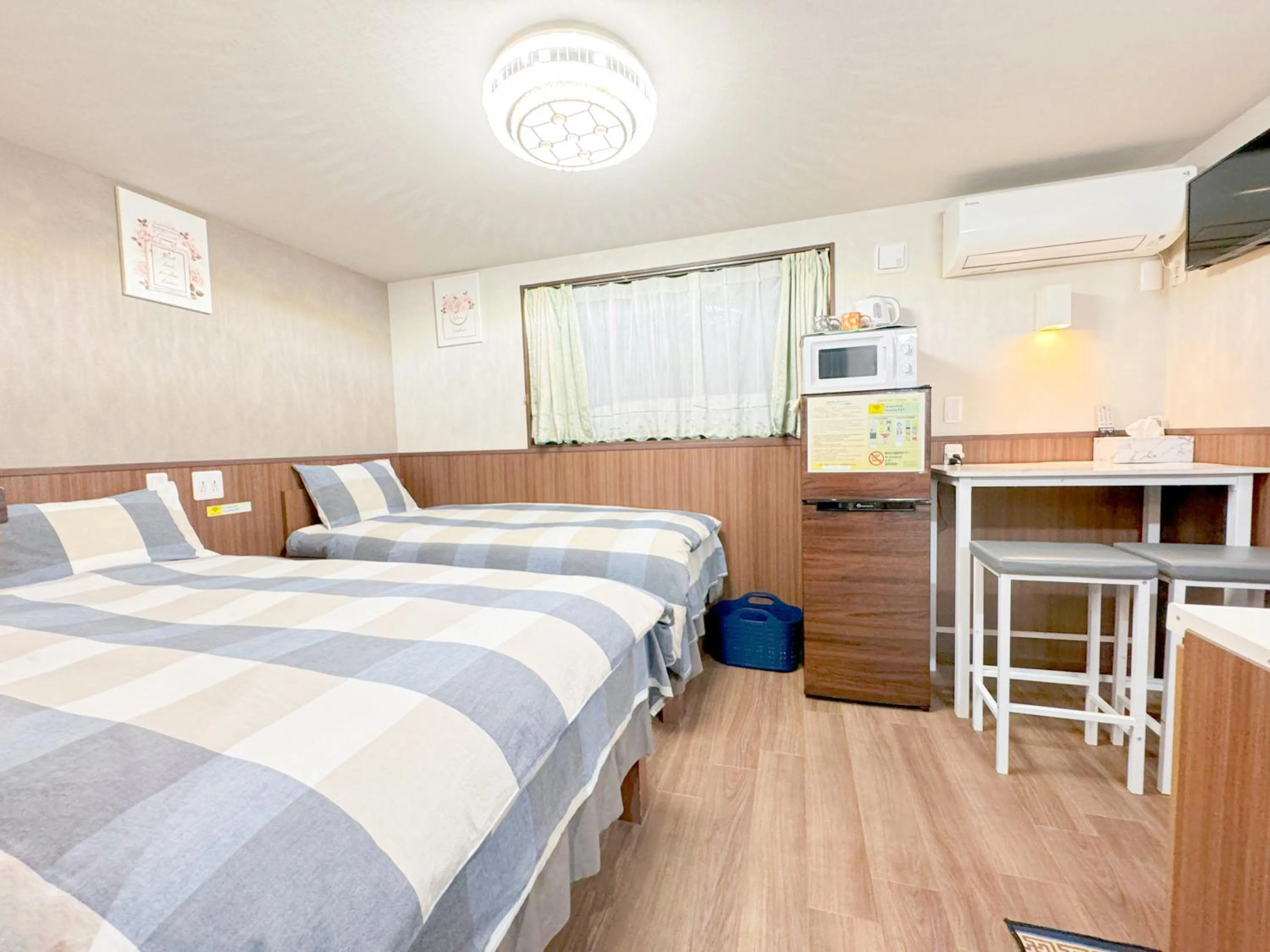 Bed in SHINJUKU WARM VILLA I