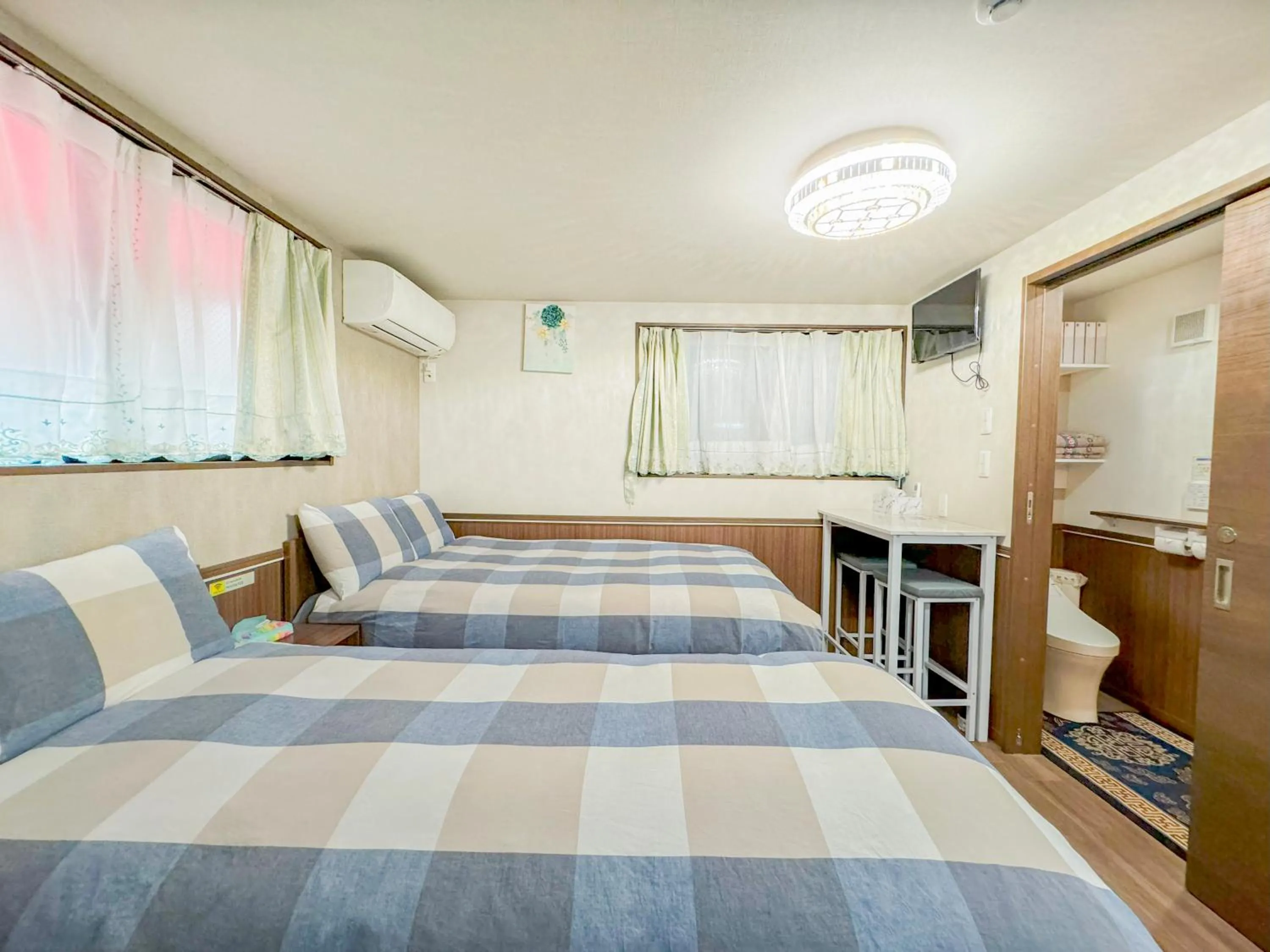 Bed in SHINJUKU WARM VILLA I