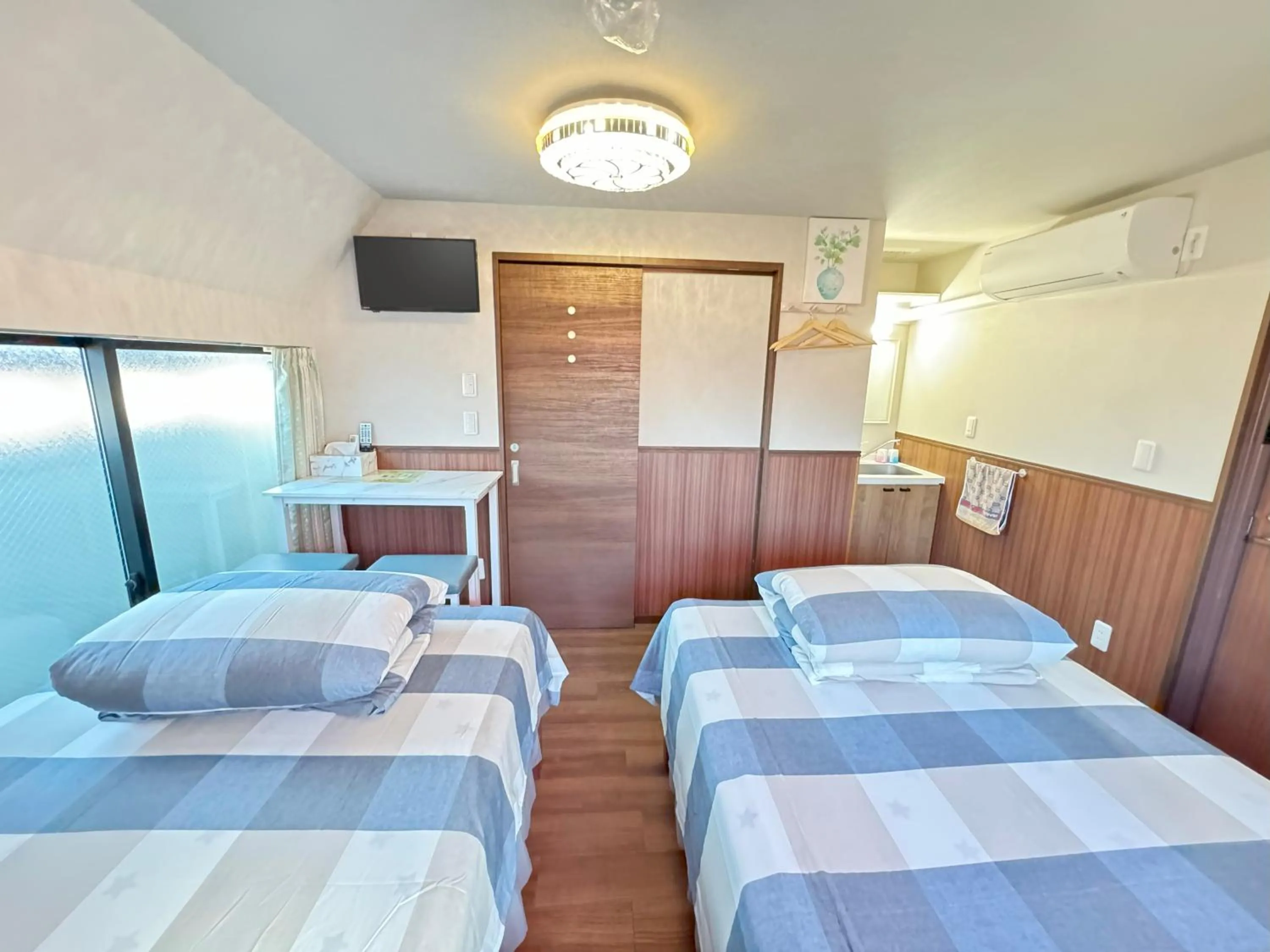 Bed in SHINJUKU WARM VILLA I