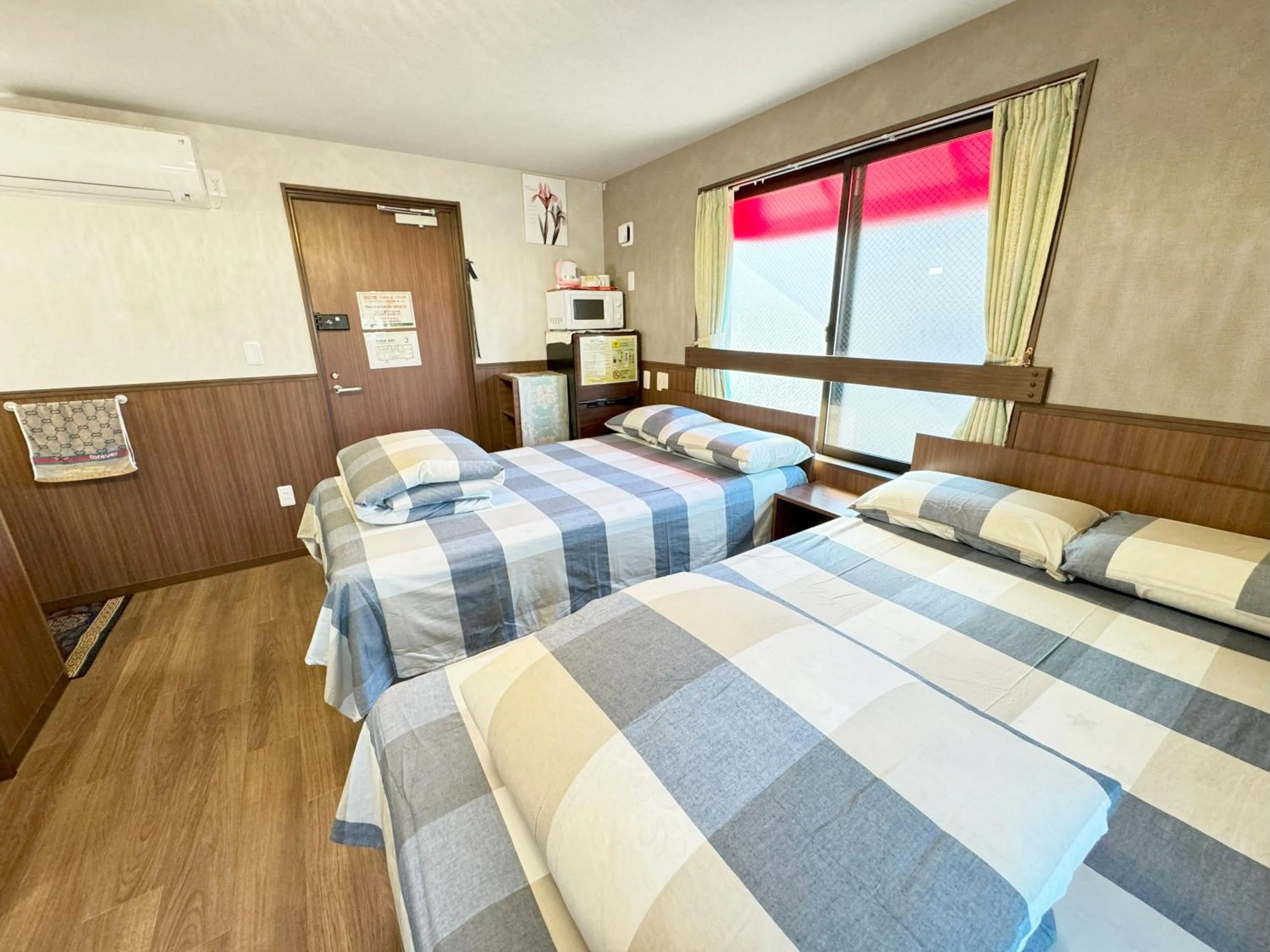 Bed in SHINJUKU WARM VILLA I