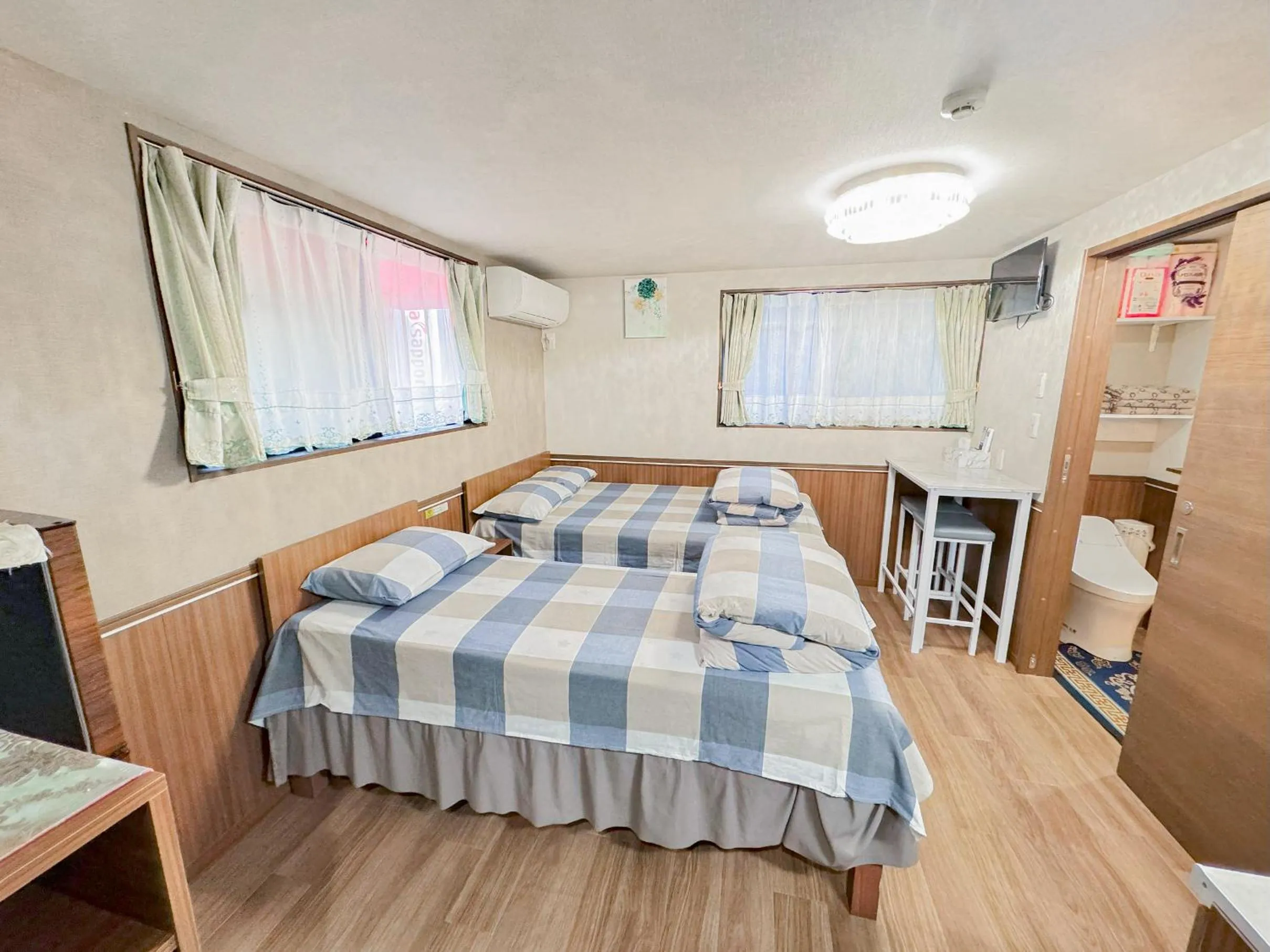 Bed in SHINJUKU WARM VILLA I