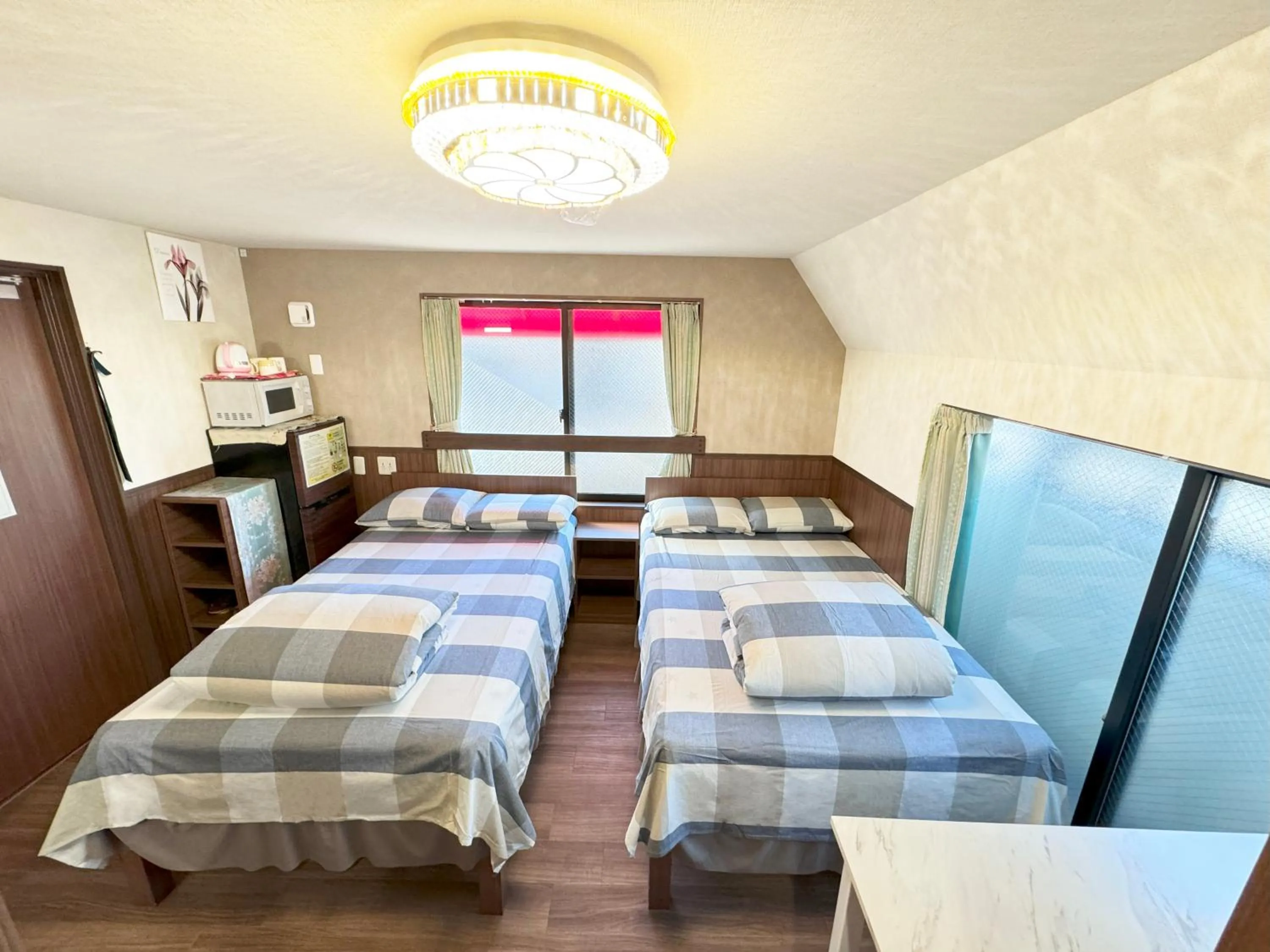 Bed in SHINJUKU WARM VILLA I