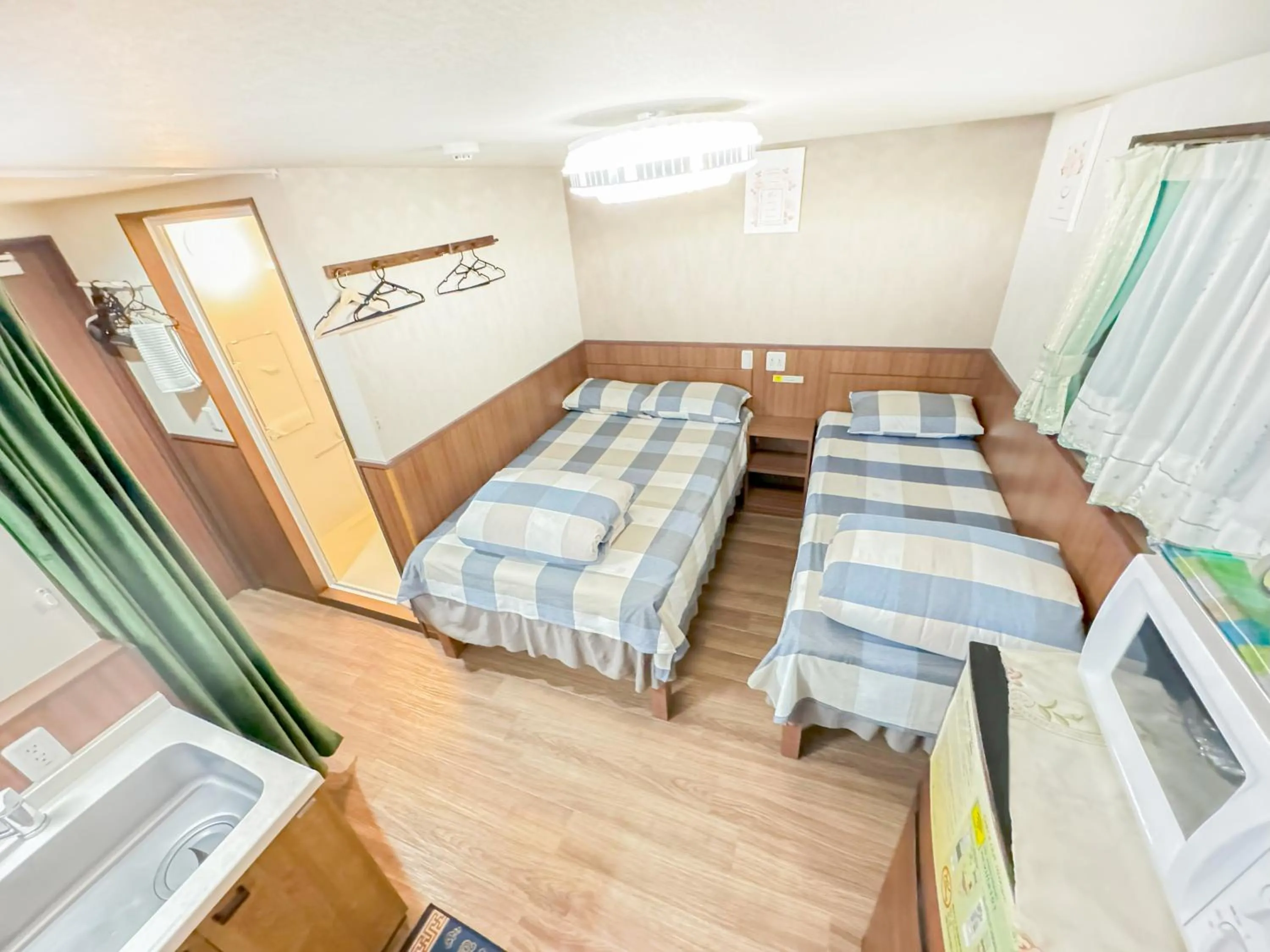 Bed in SHINJUKU WARM VILLA I