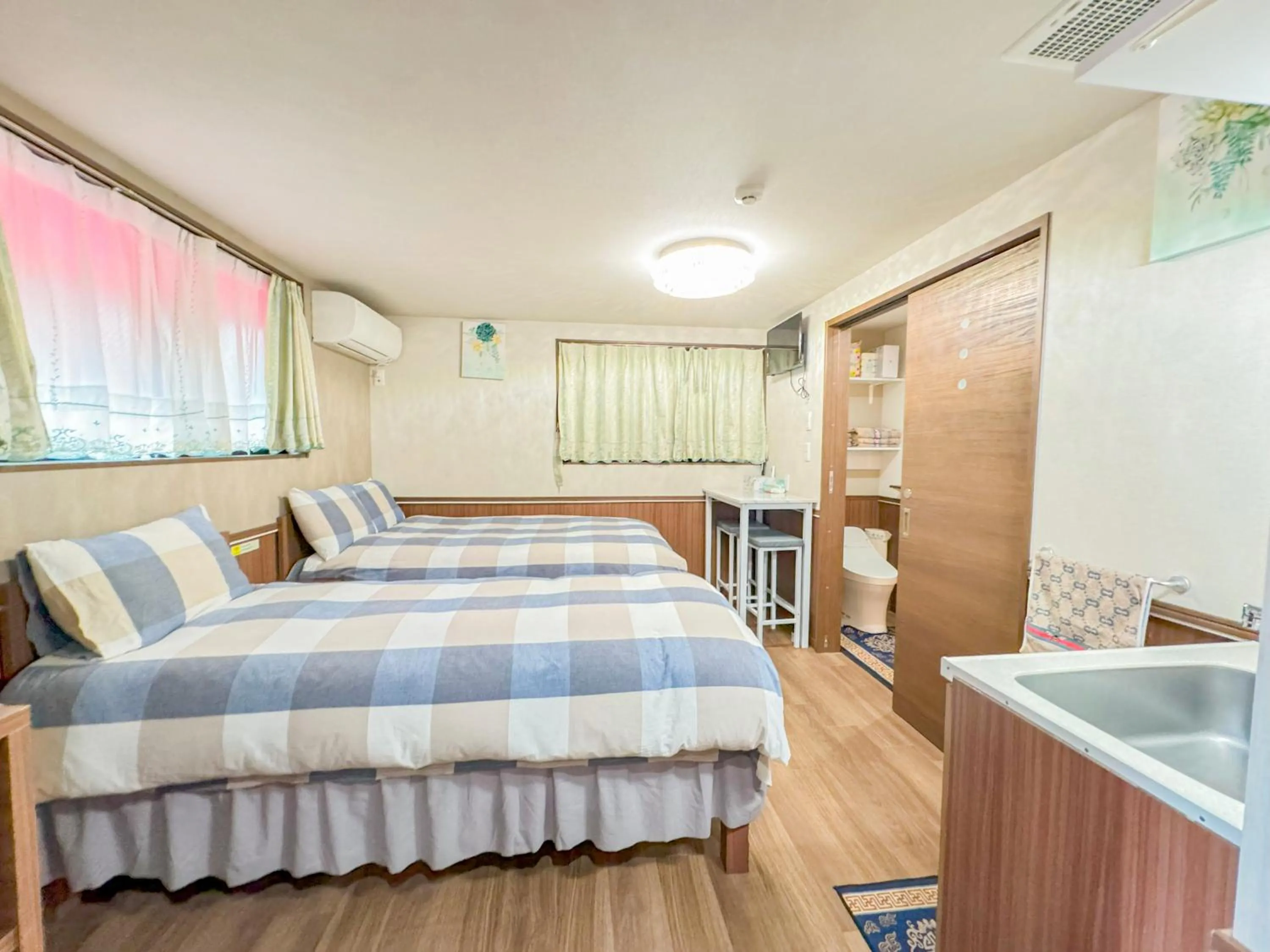 Bed in SHINJUKU WARM VILLA I