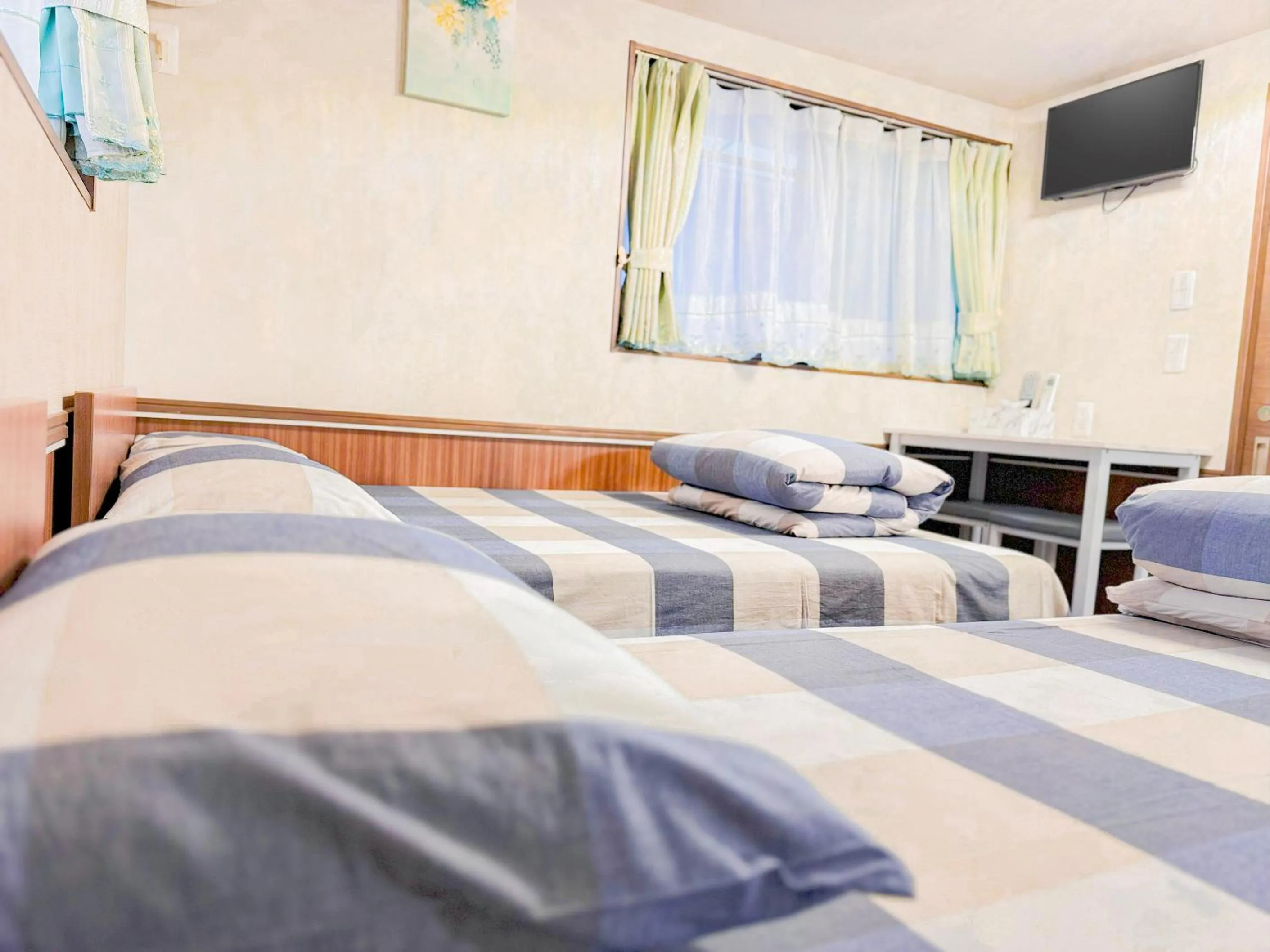 Bed in SHINJUKU WARM VILLA I