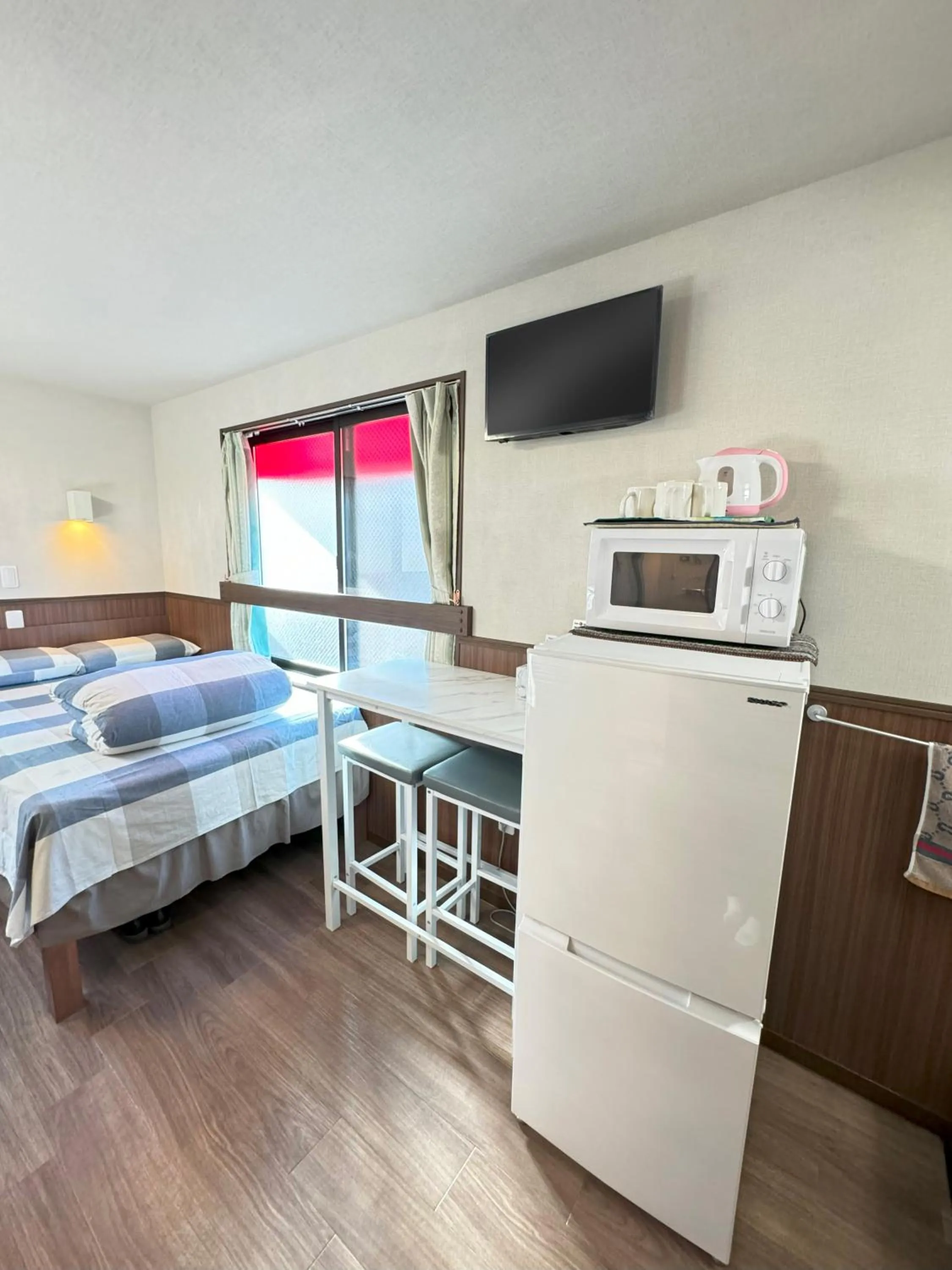 Bed in SHINJUKU WARM VILLA I