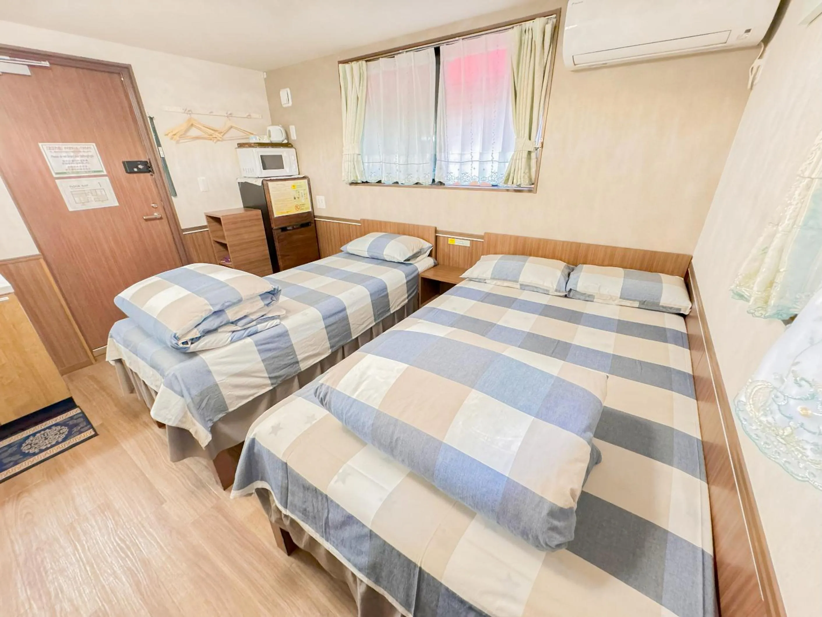 Bed in SHINJUKU WARM VILLA I