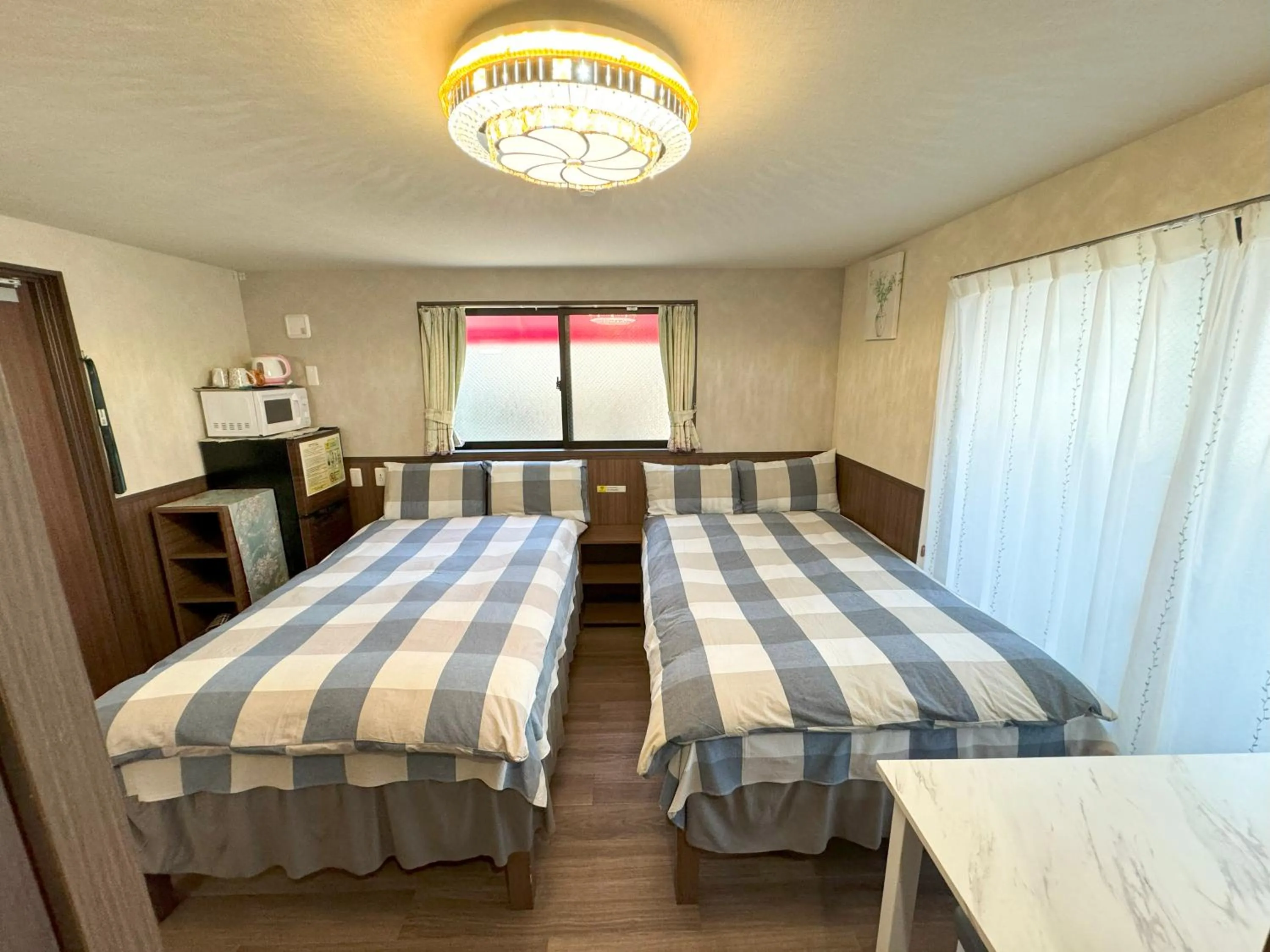 Bed in SHINJUKU WARM VILLA I