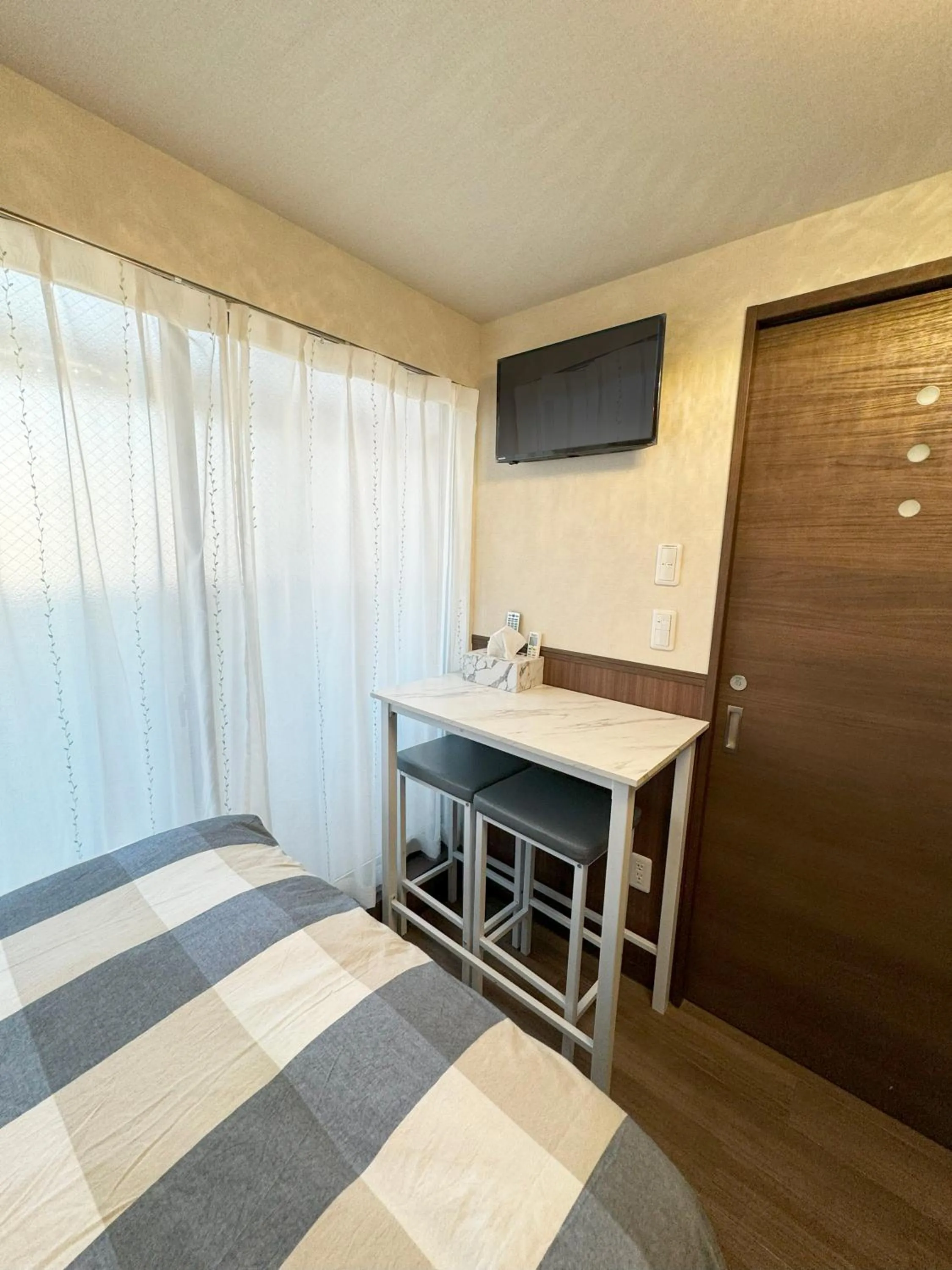 Bed in SHINJUKU WARM VILLA I