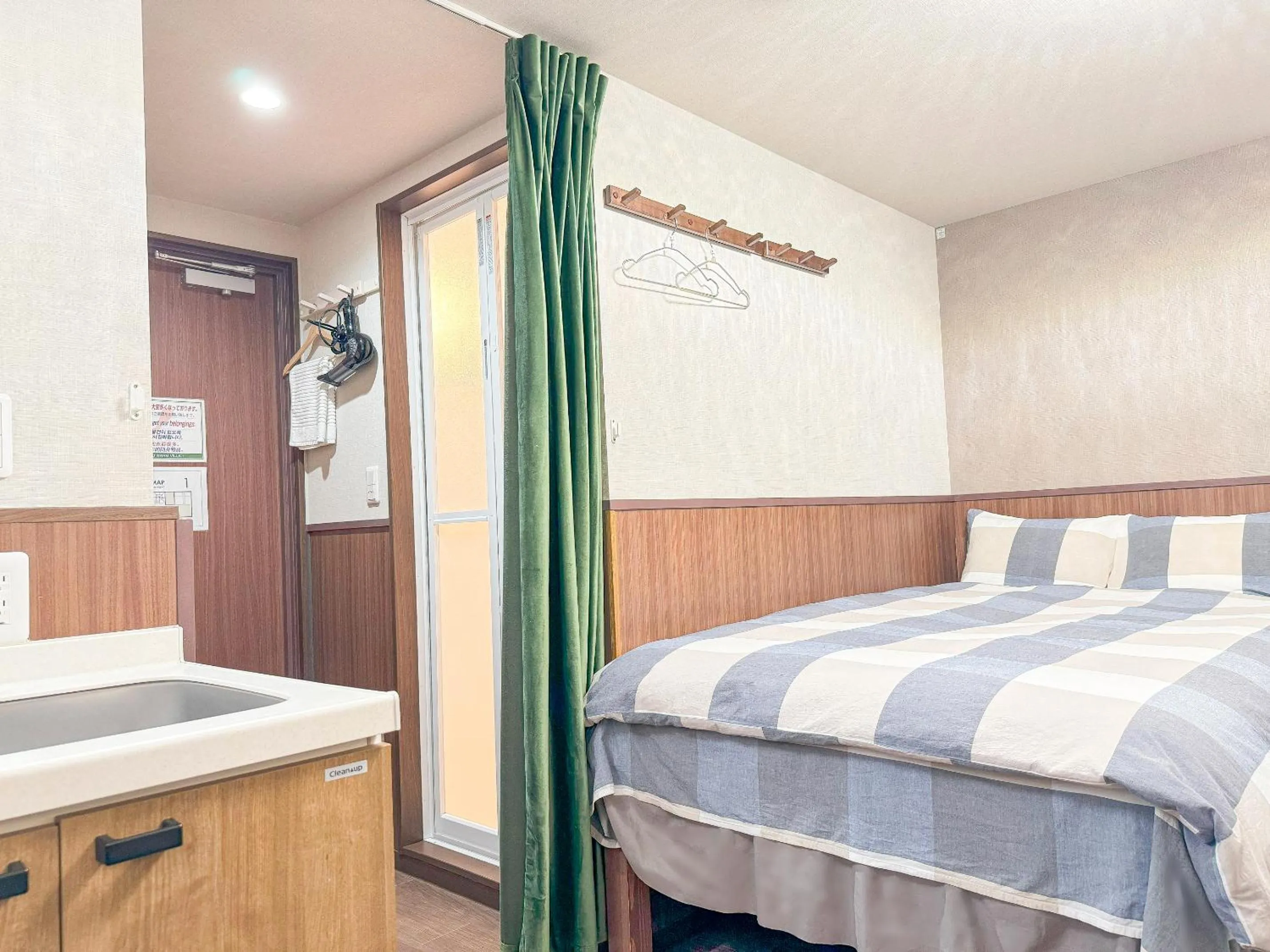 Bed in SHINJUKU WARM VILLA I