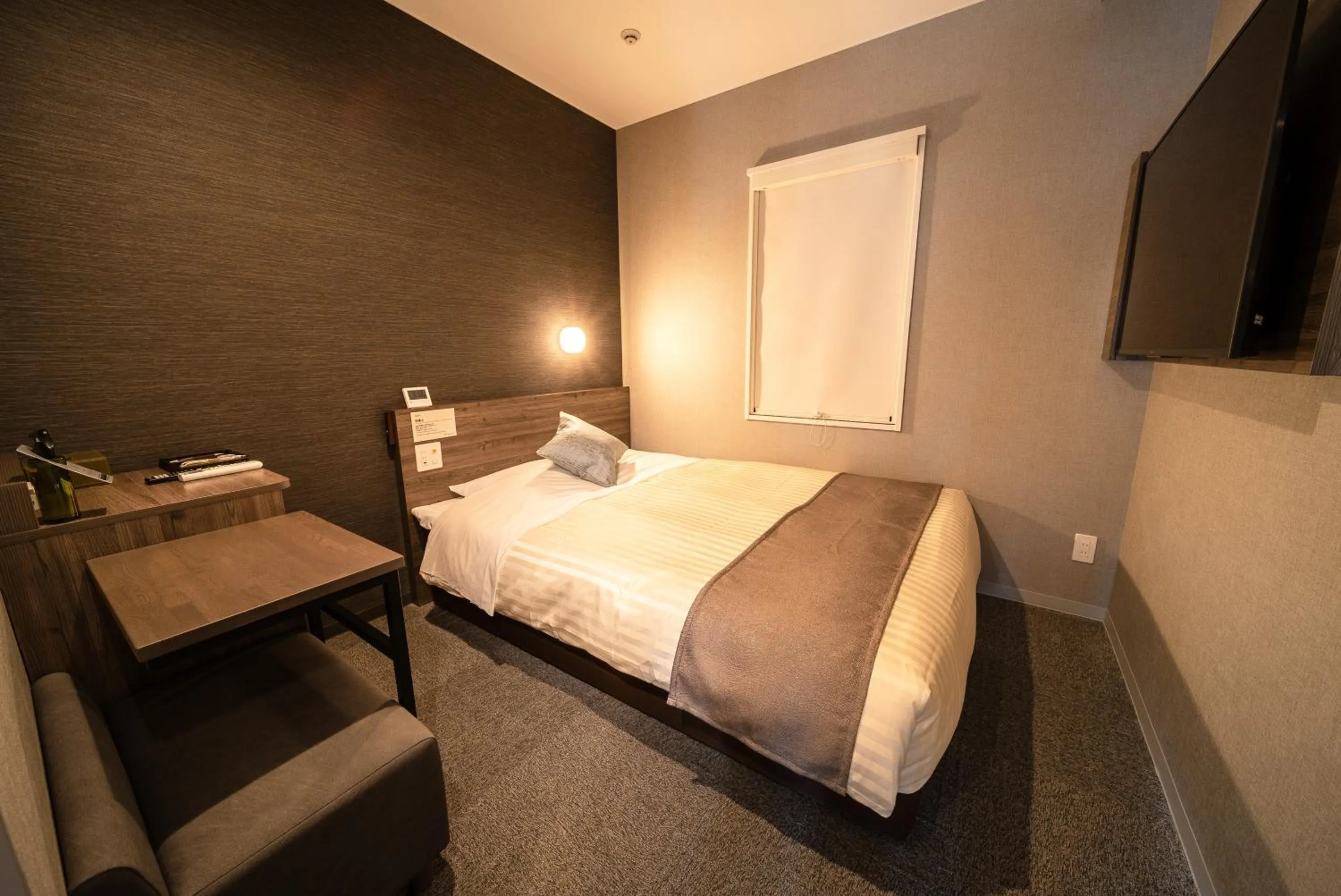 Bed in Super Hotel Premier Ikebukuro Natural Hot Spring