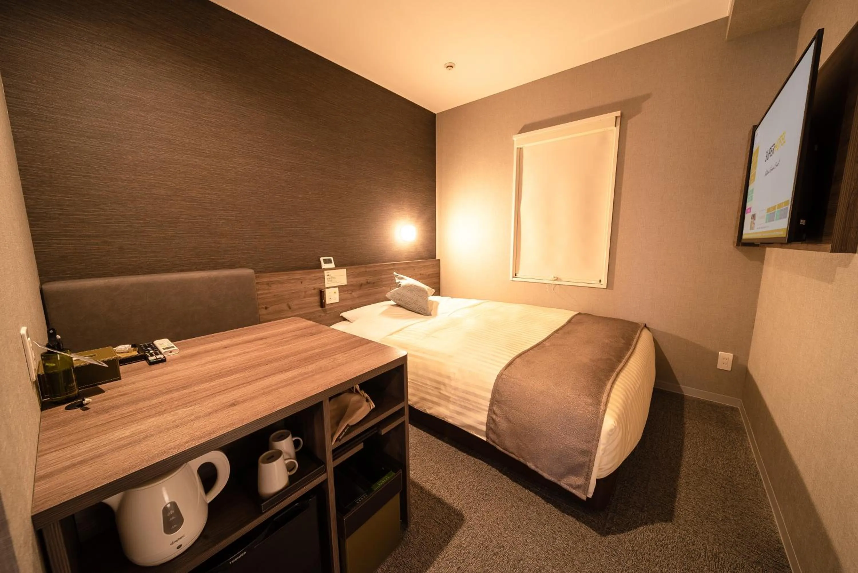 Bed in Super Hotel Premier Ikebukuro Natural Hot Spring