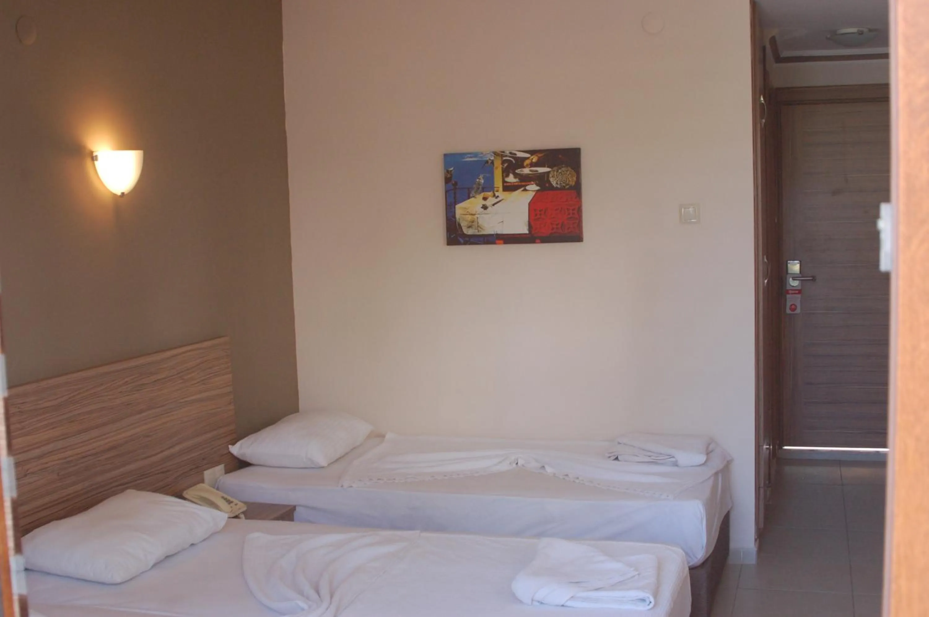 Bed in Astoria Beach Hotel