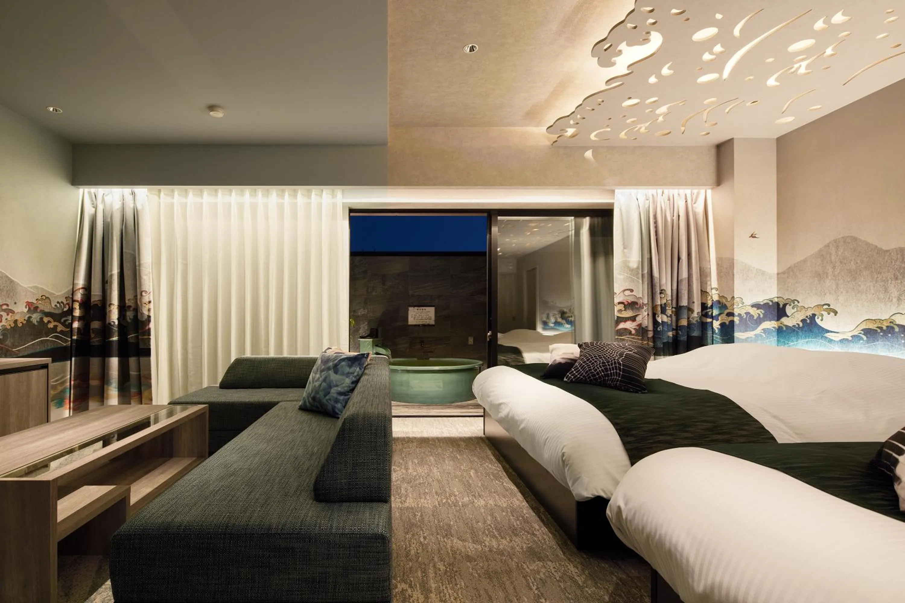 Living room, Bed in Yatomi Hotel Nuqu Natural Hot Spring