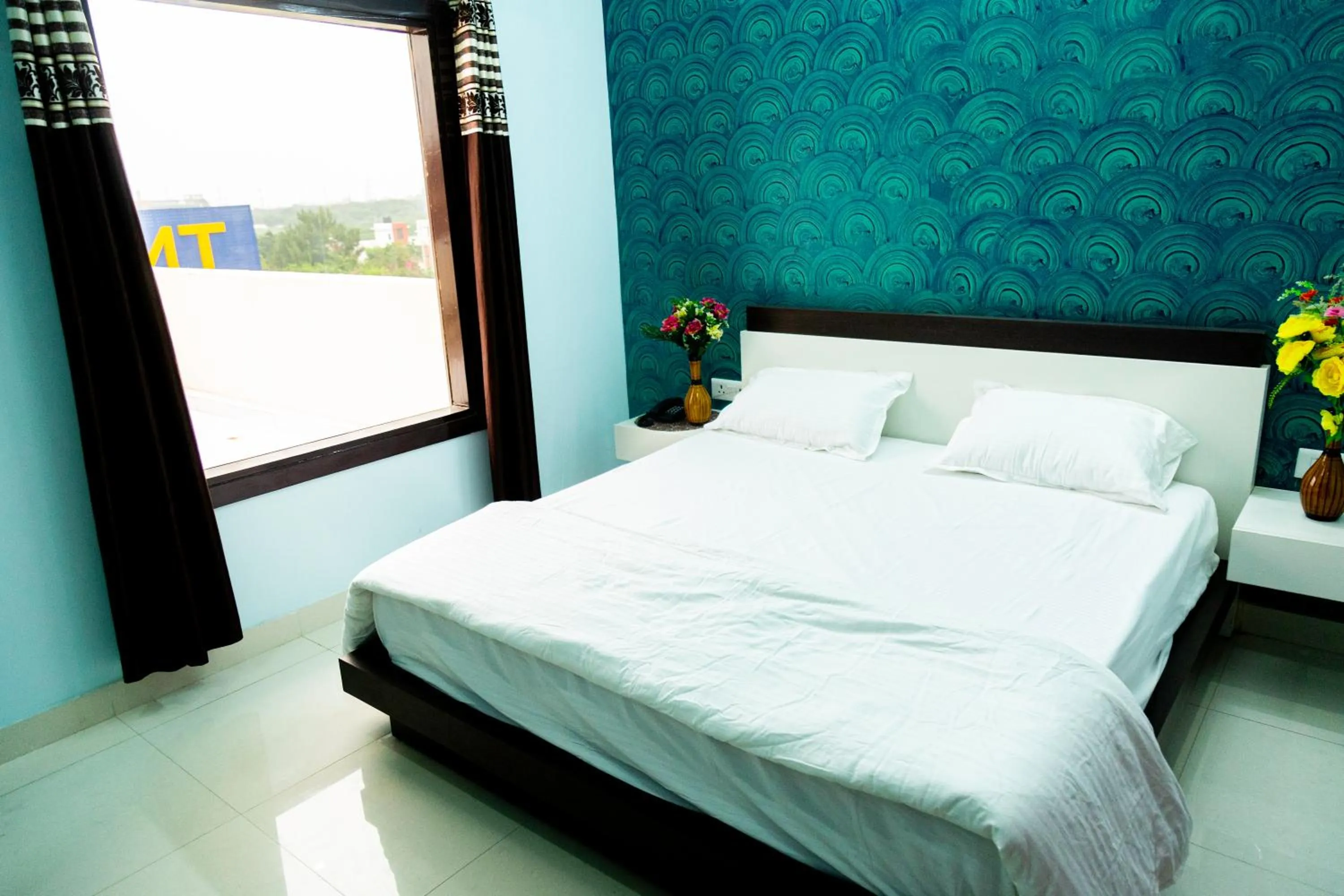 Bed in Jagdambey Hotel