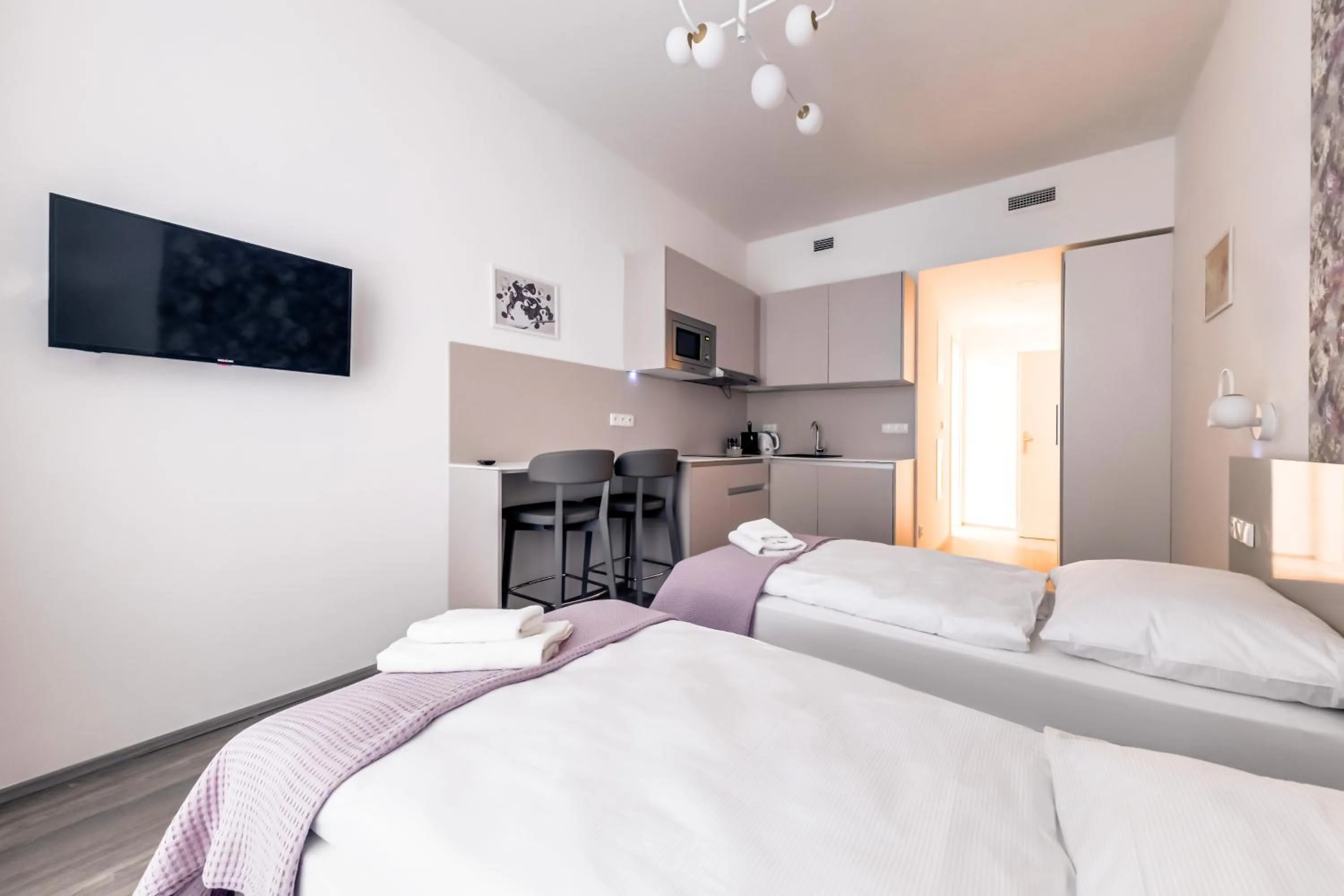Kitchen or kitchenette, Bed in Kora Apartments