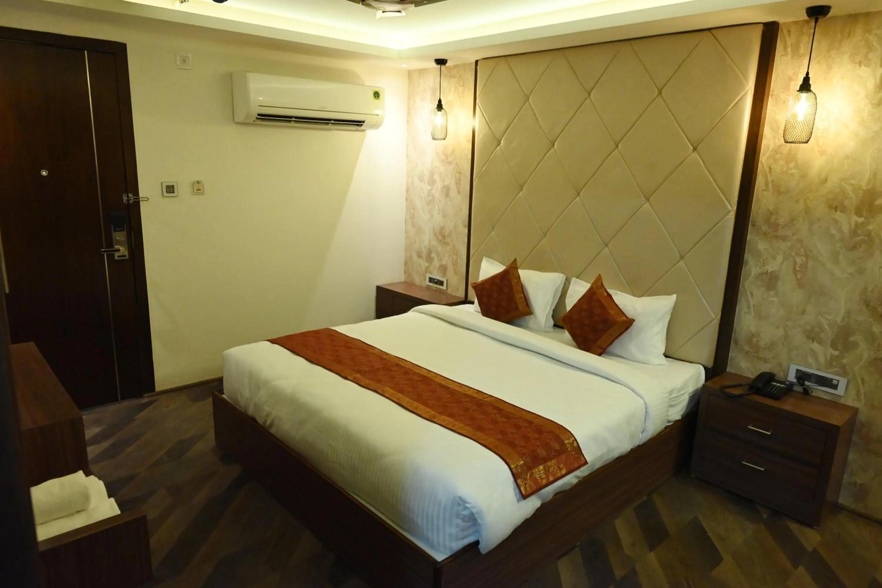 Bedroom in THE TRIUMPH HOTEL