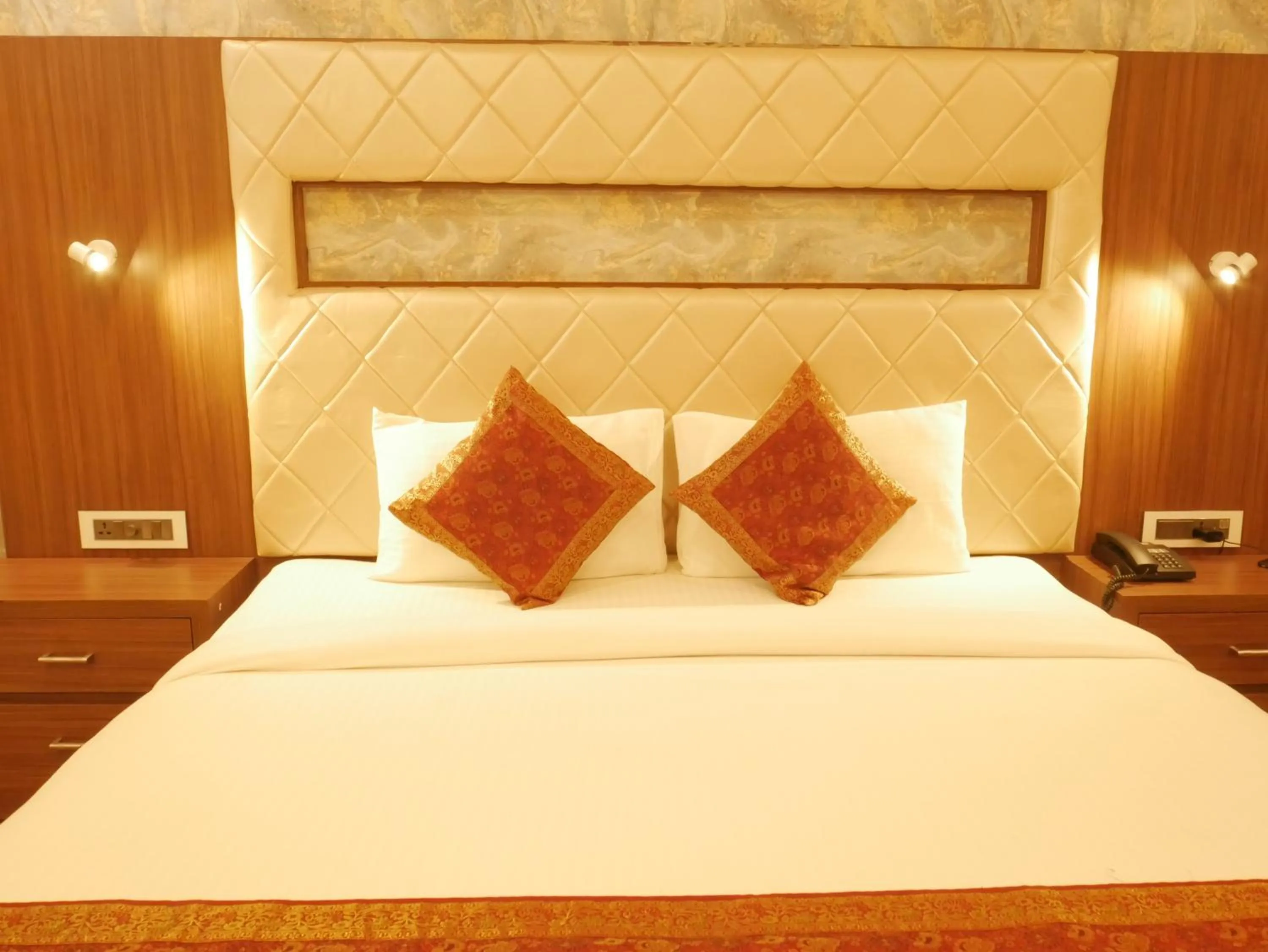 Bedroom in THE TRIUMPH HOTEL