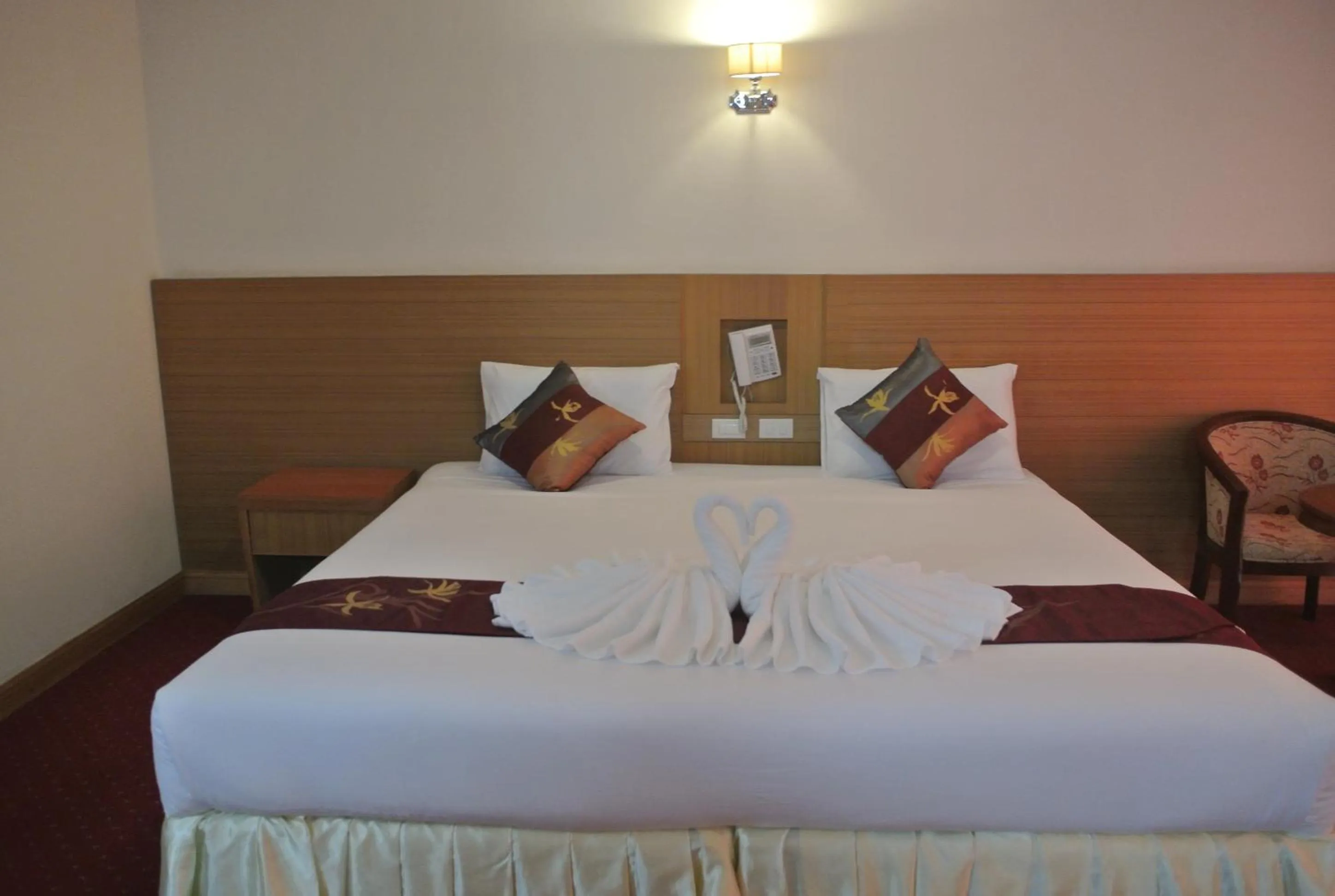 Bed in Chaikana Thani Hotel