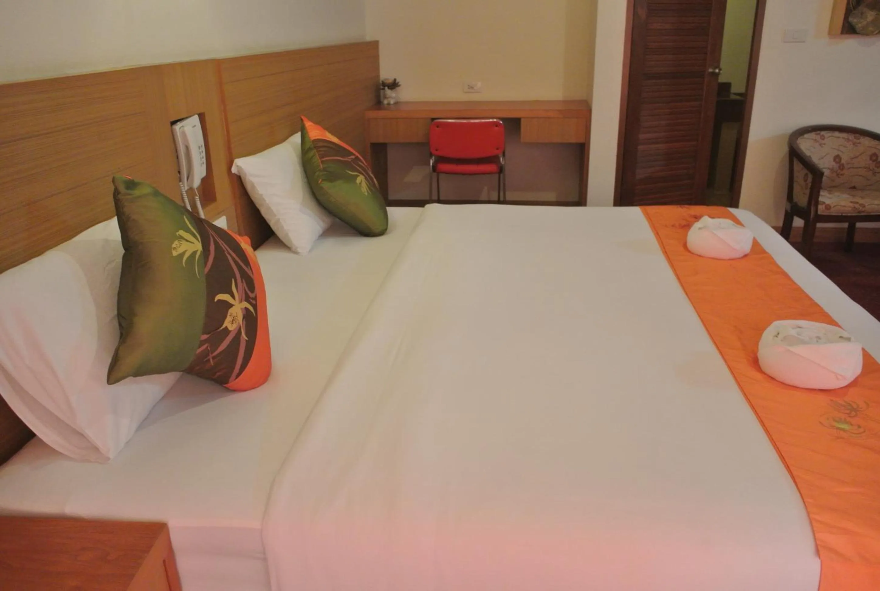 Bed in Chaikana Thani Hotel