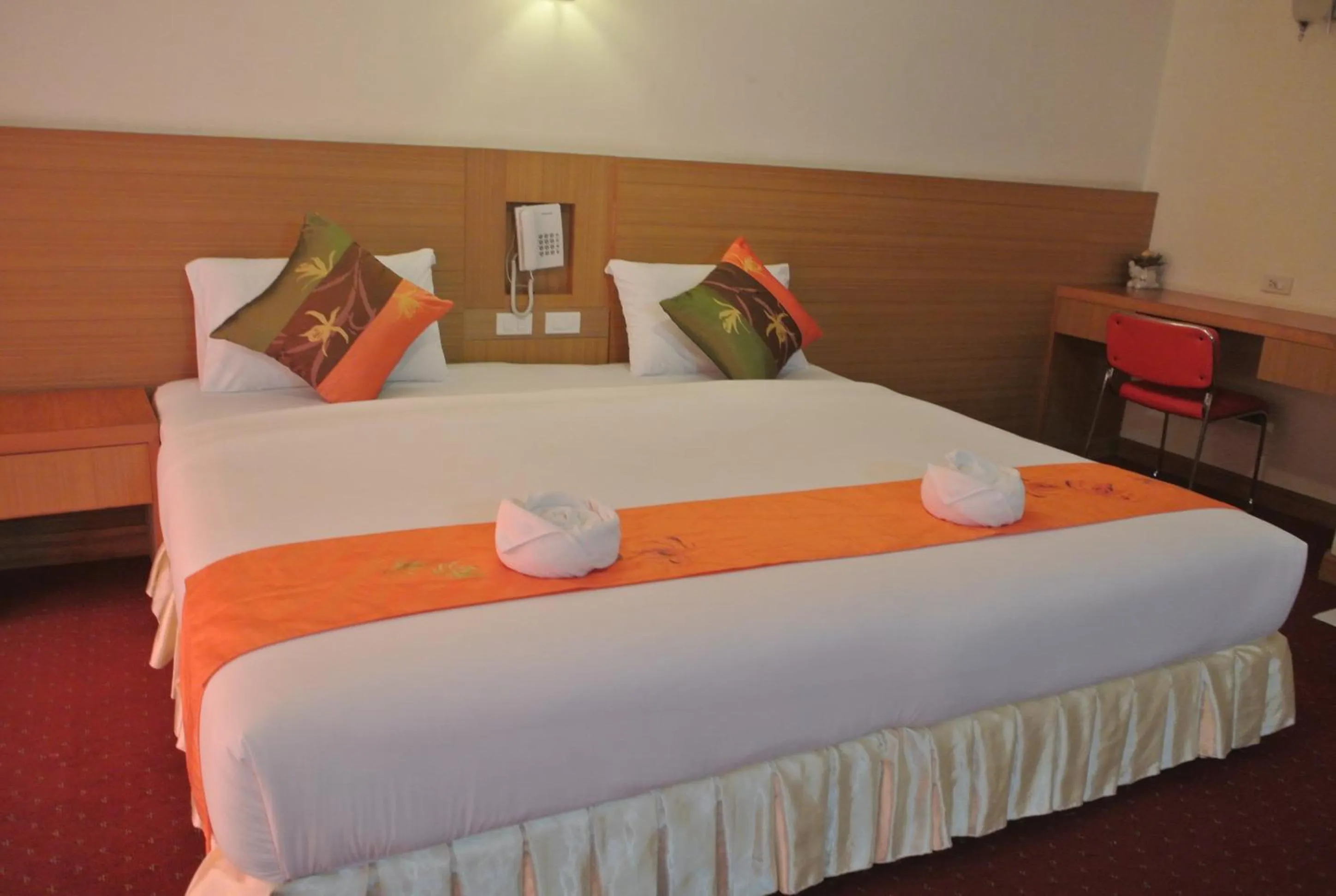 Bed in Chaikana Thani Hotel