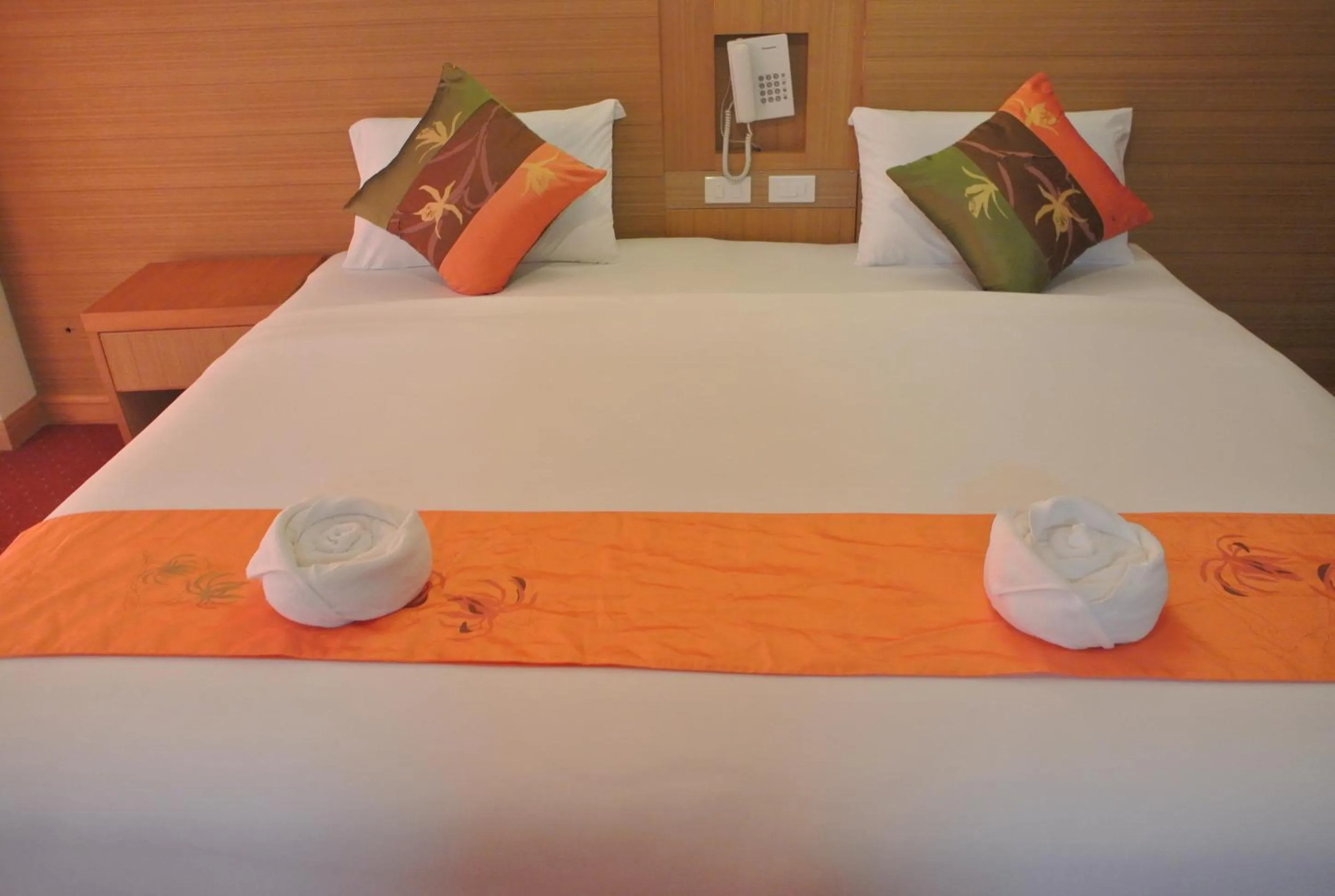 Bed in Chaikana Thani Hotel