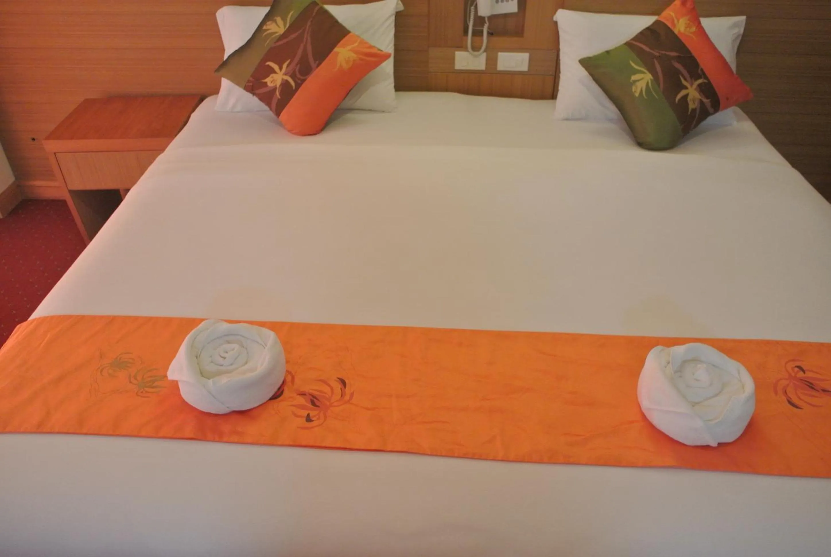 Bed in Chaikana Thani Hotel