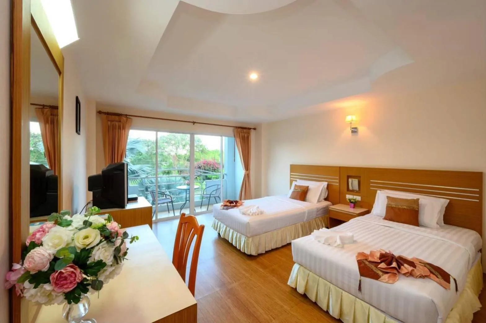 Bed in Chaikana Thani Hotel