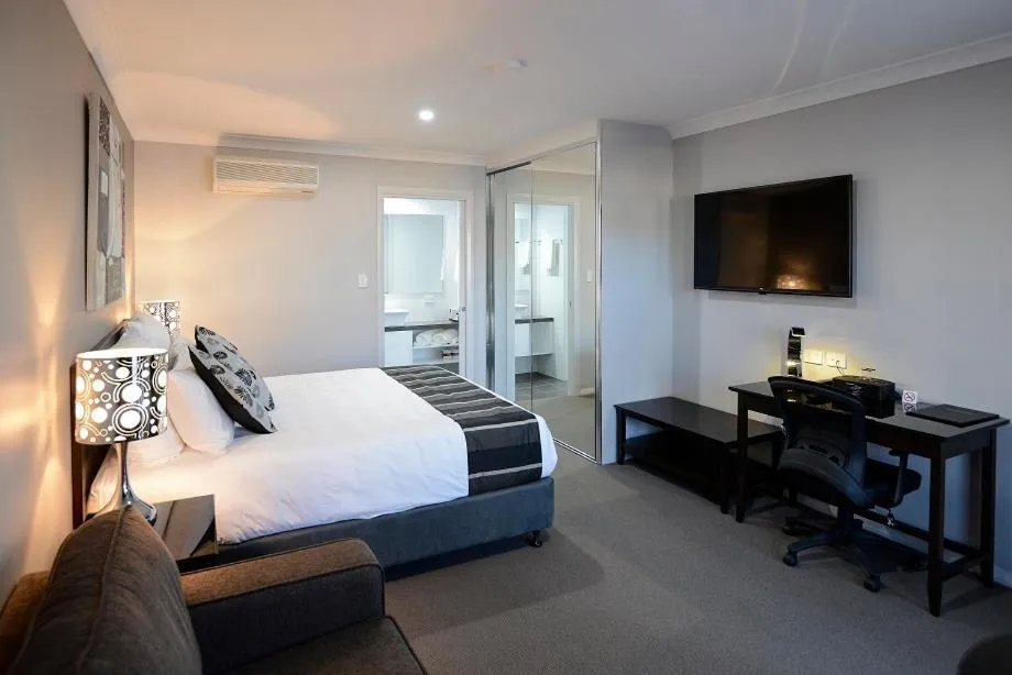 Bed in Astro Dish Motor Inn