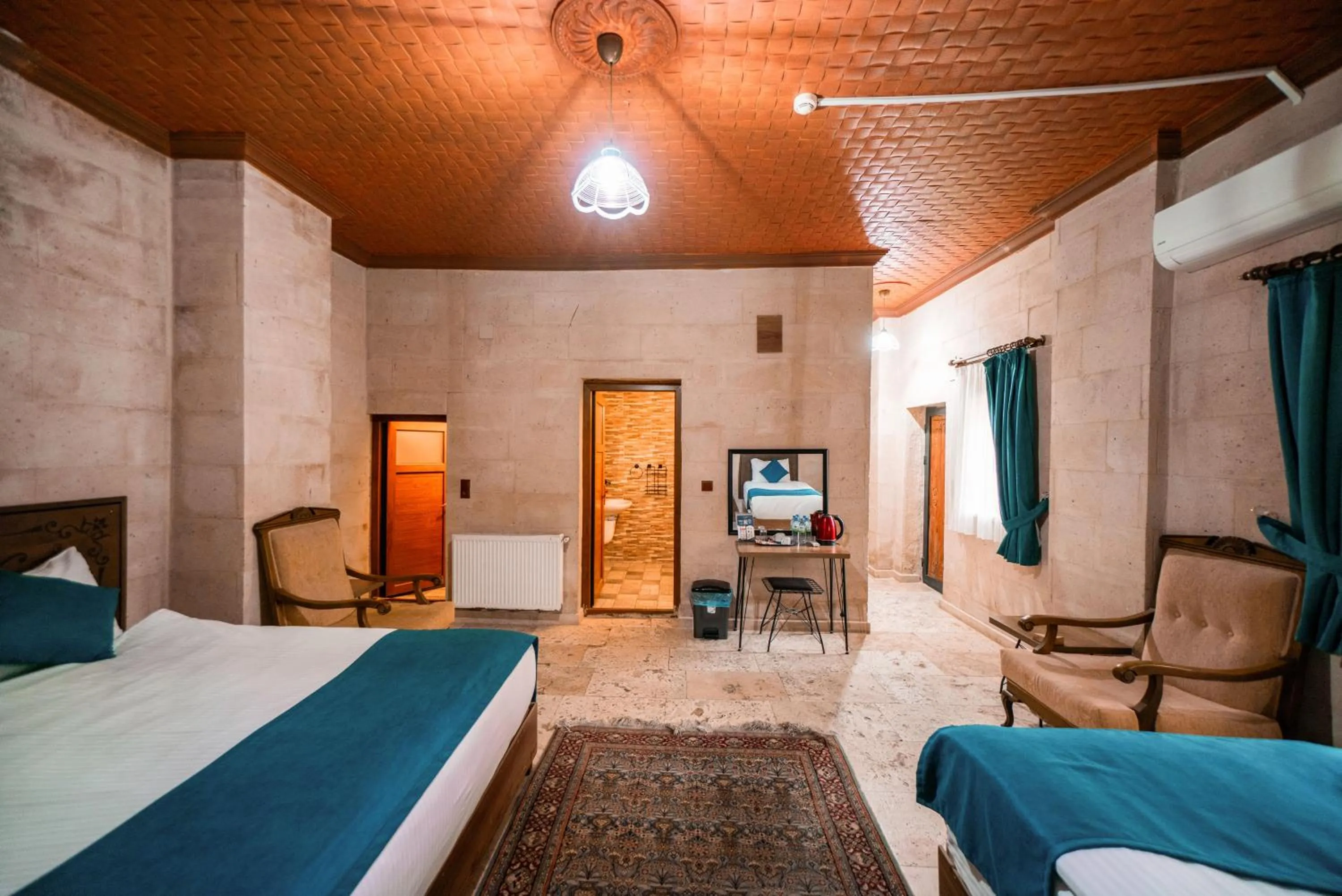 Bed in Azalea Terrace Cave Hotel