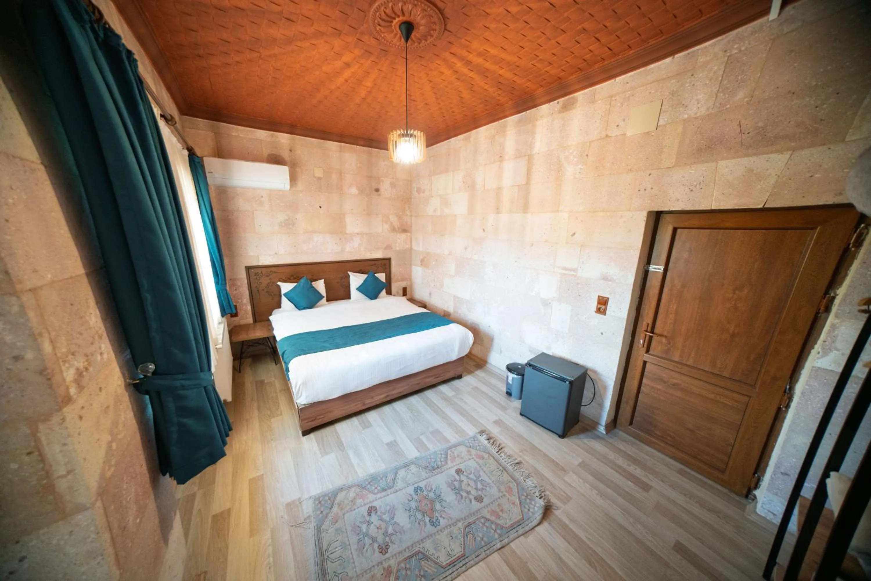 Bed in Azalea Terrace Cave Hotel