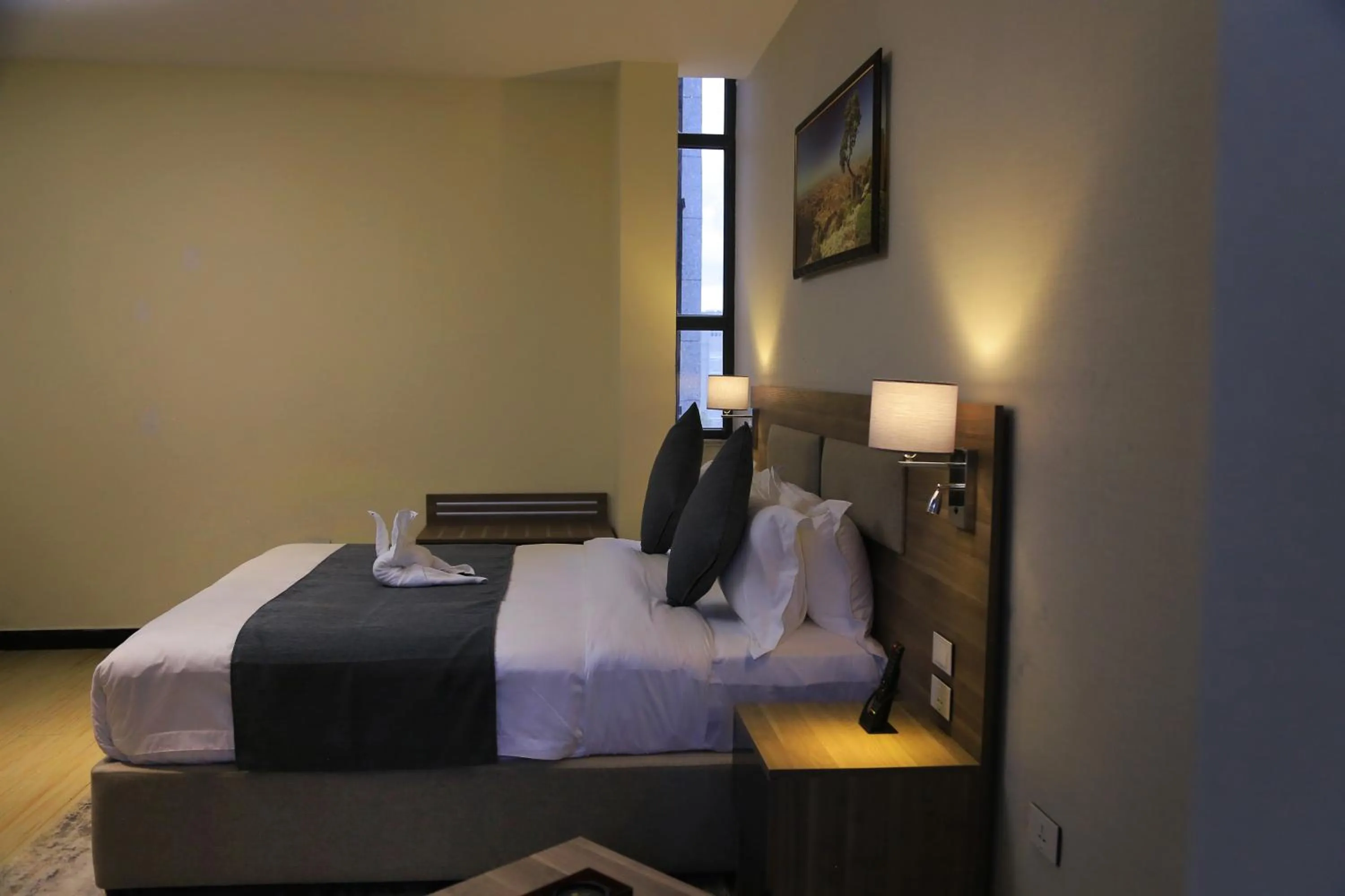 Bed in Triple E Hotel and Spa