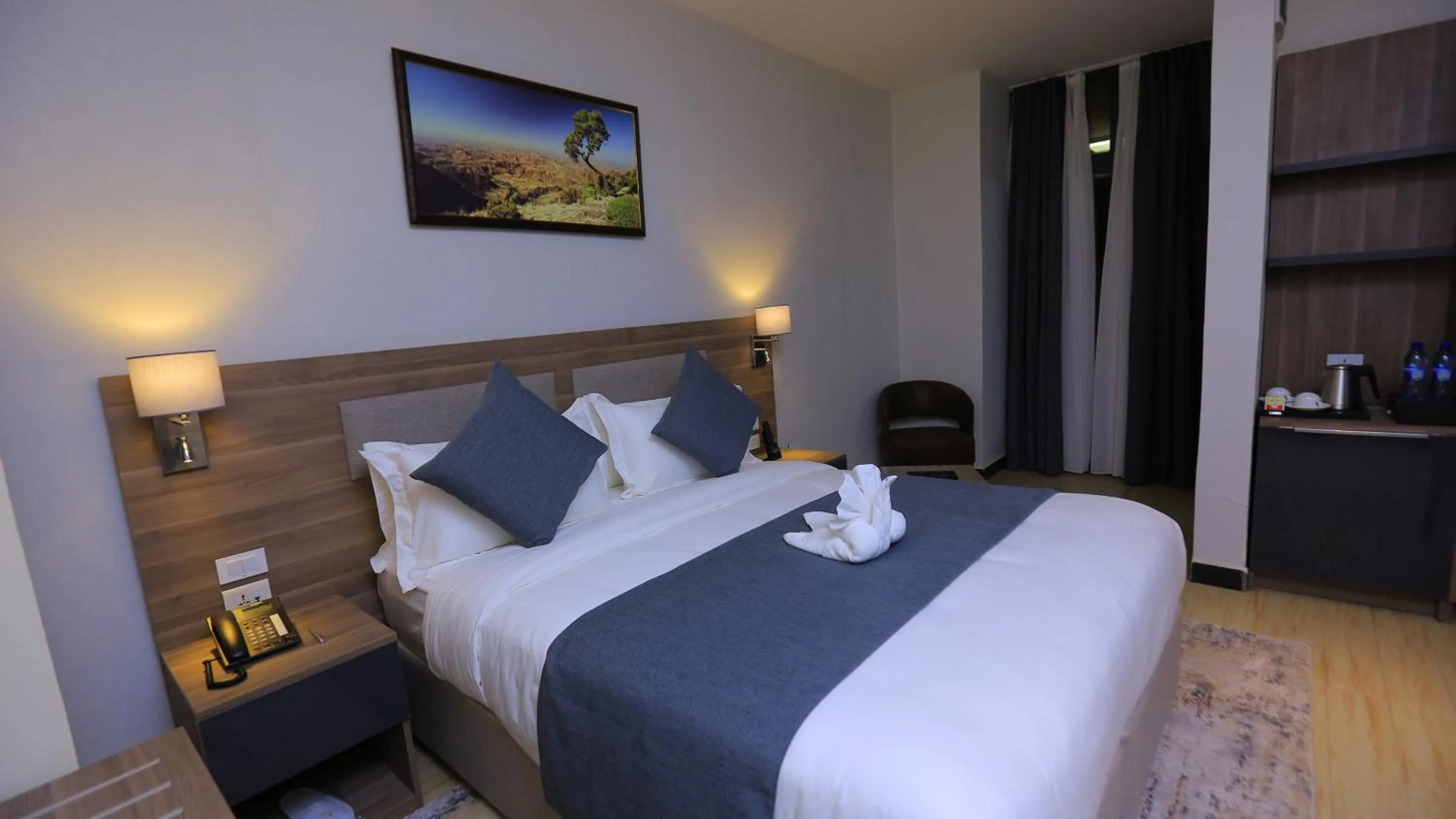 Bed in Triple E Hotel and Spa