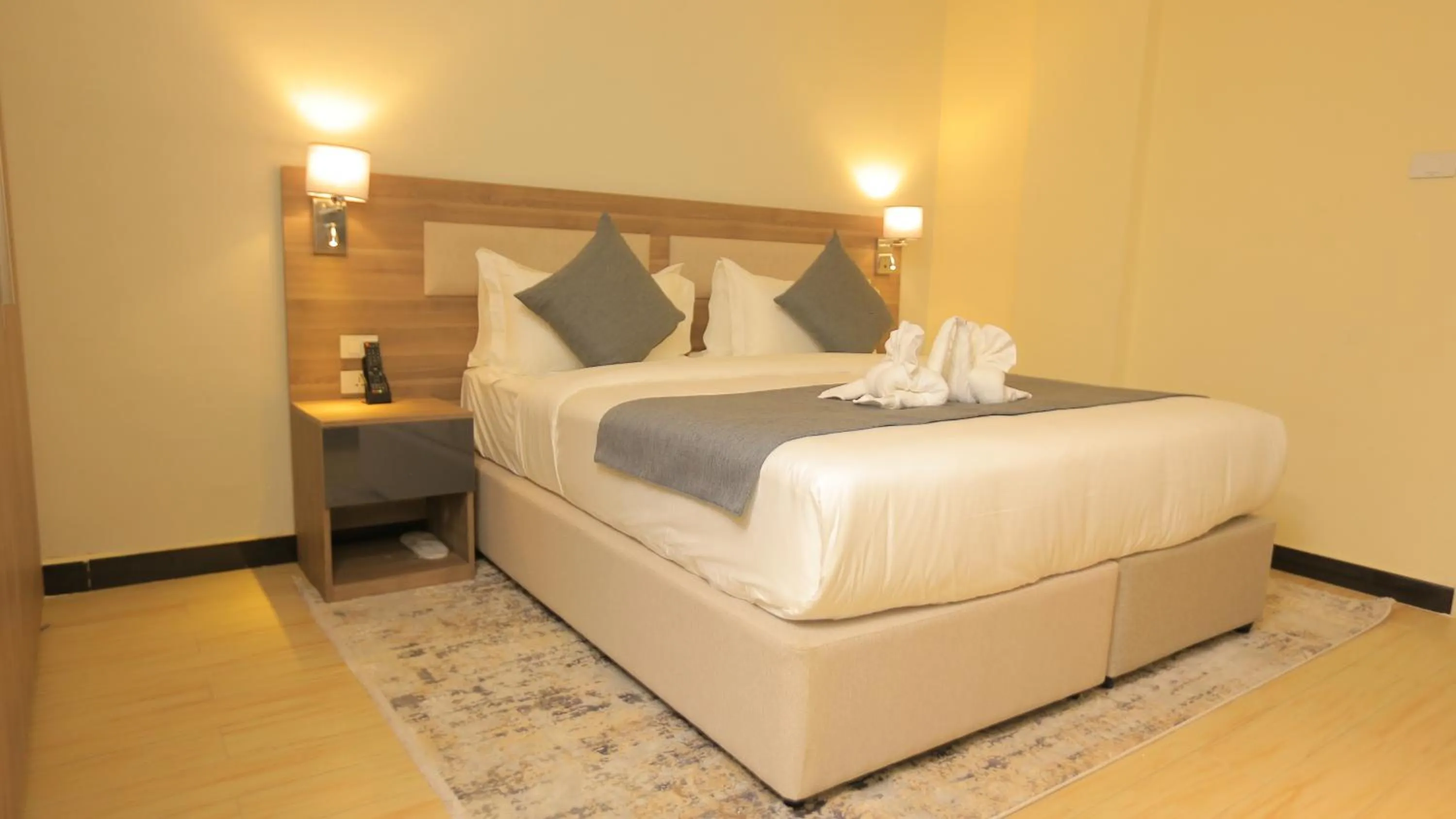 Bed in Triple E Hotel and Spa