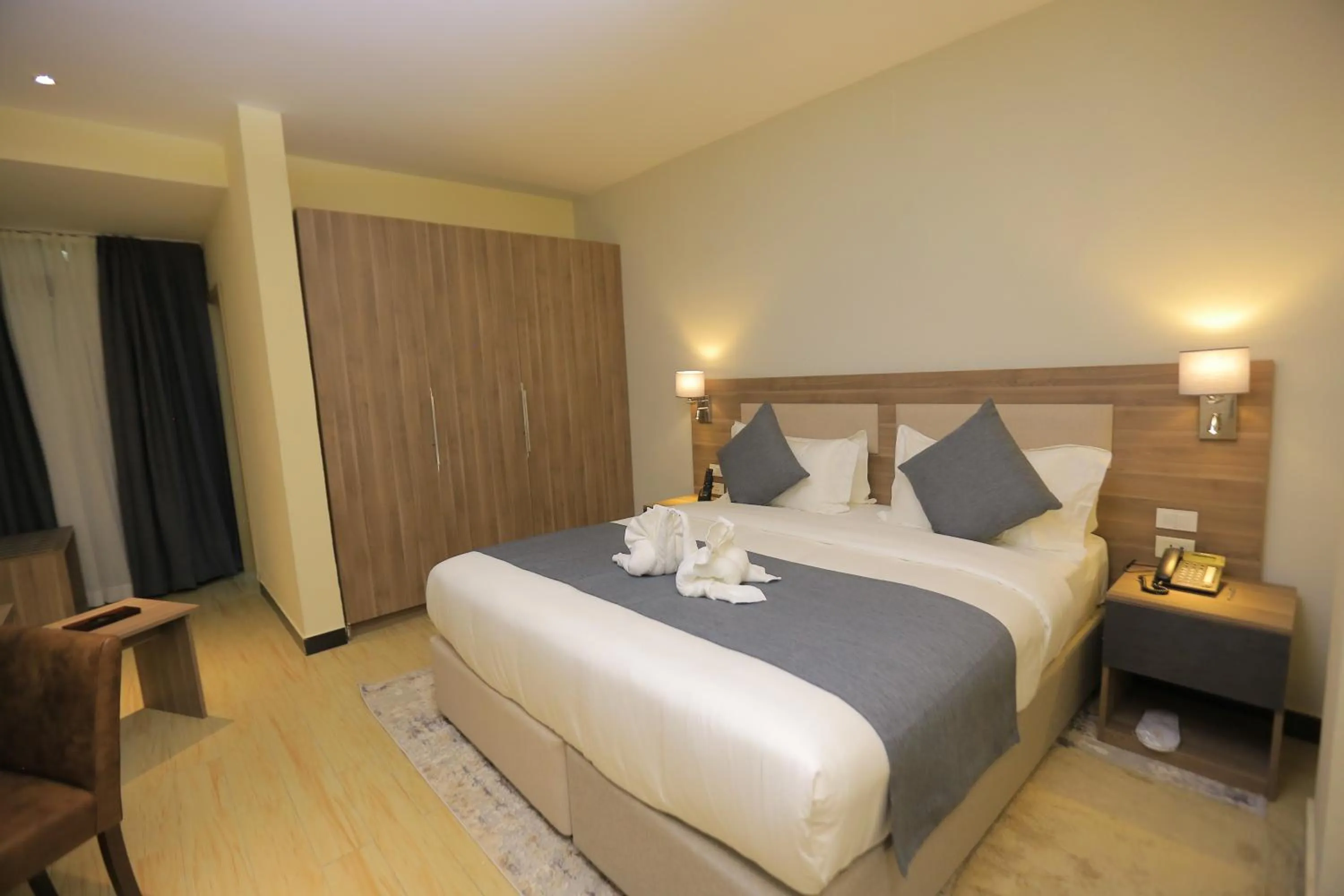 Bed in Triple E Hotel and Spa