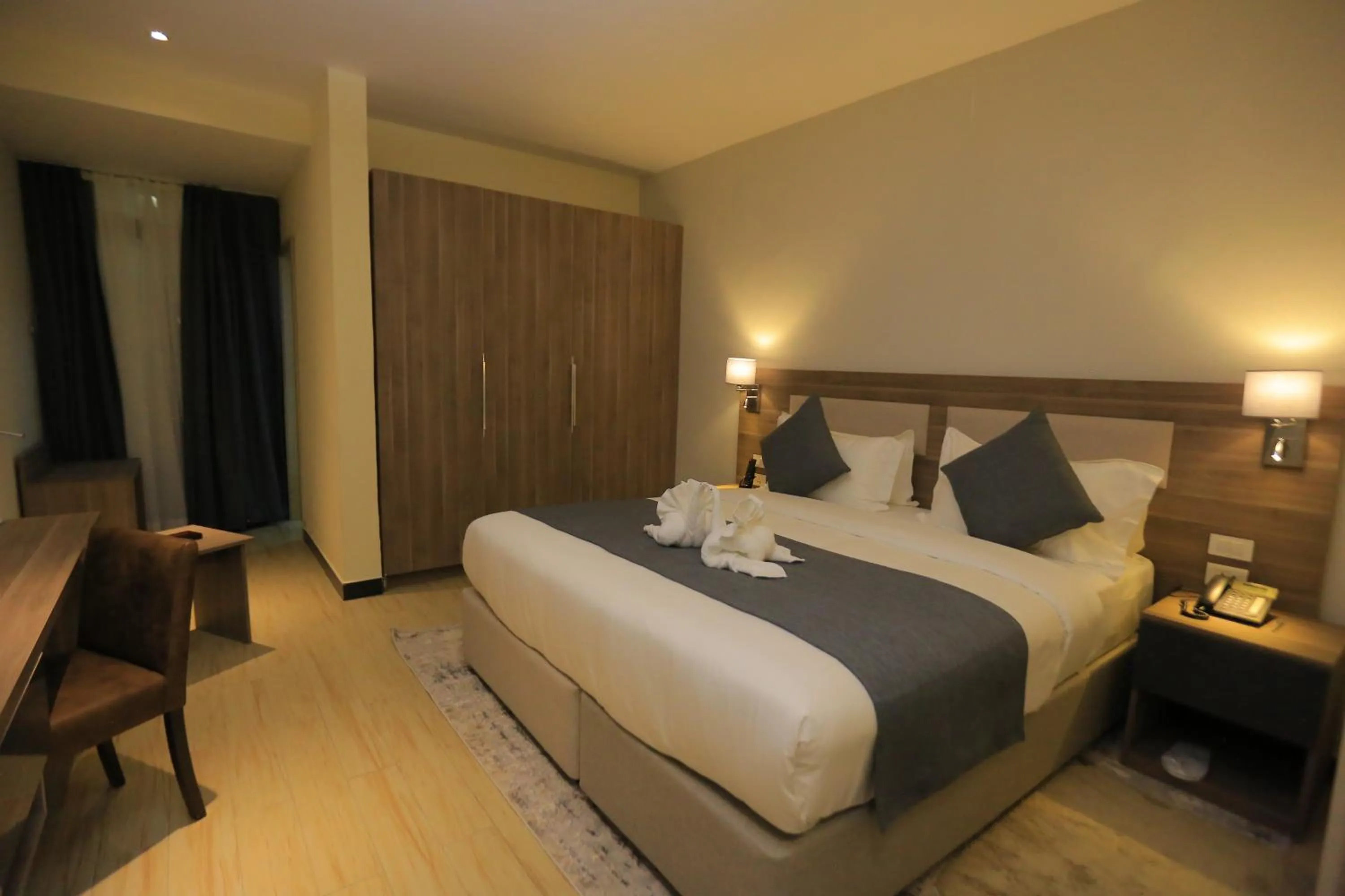 Bed in Triple E Hotel and Spa