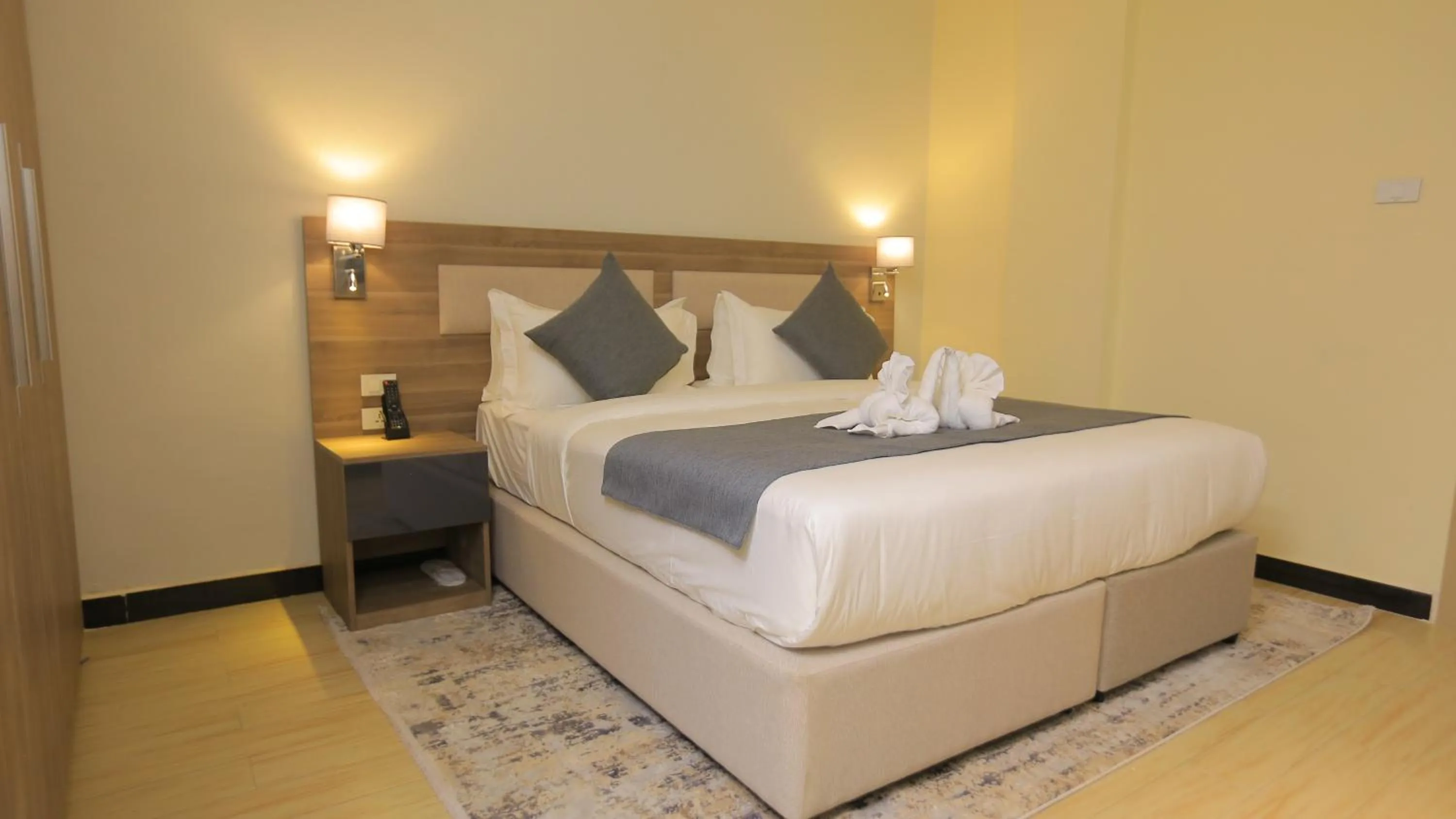 Bed in Triple E Hotel and Spa