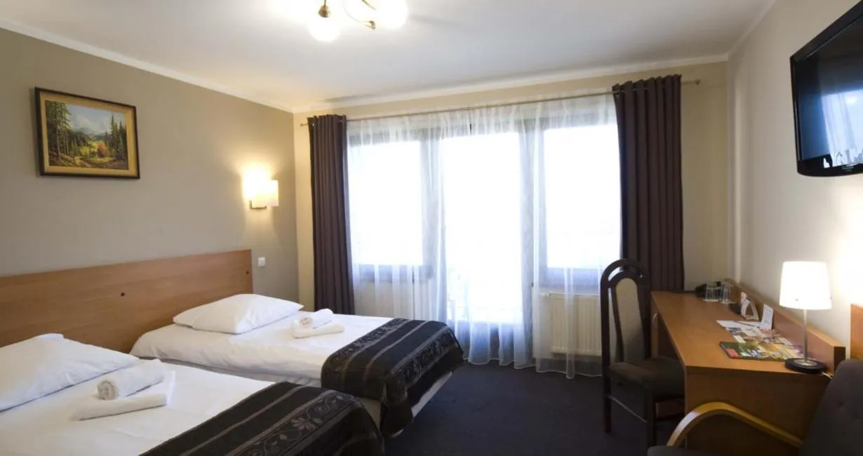 Bed in Hotel Zimnik Luksus Natury Spa & Wellness