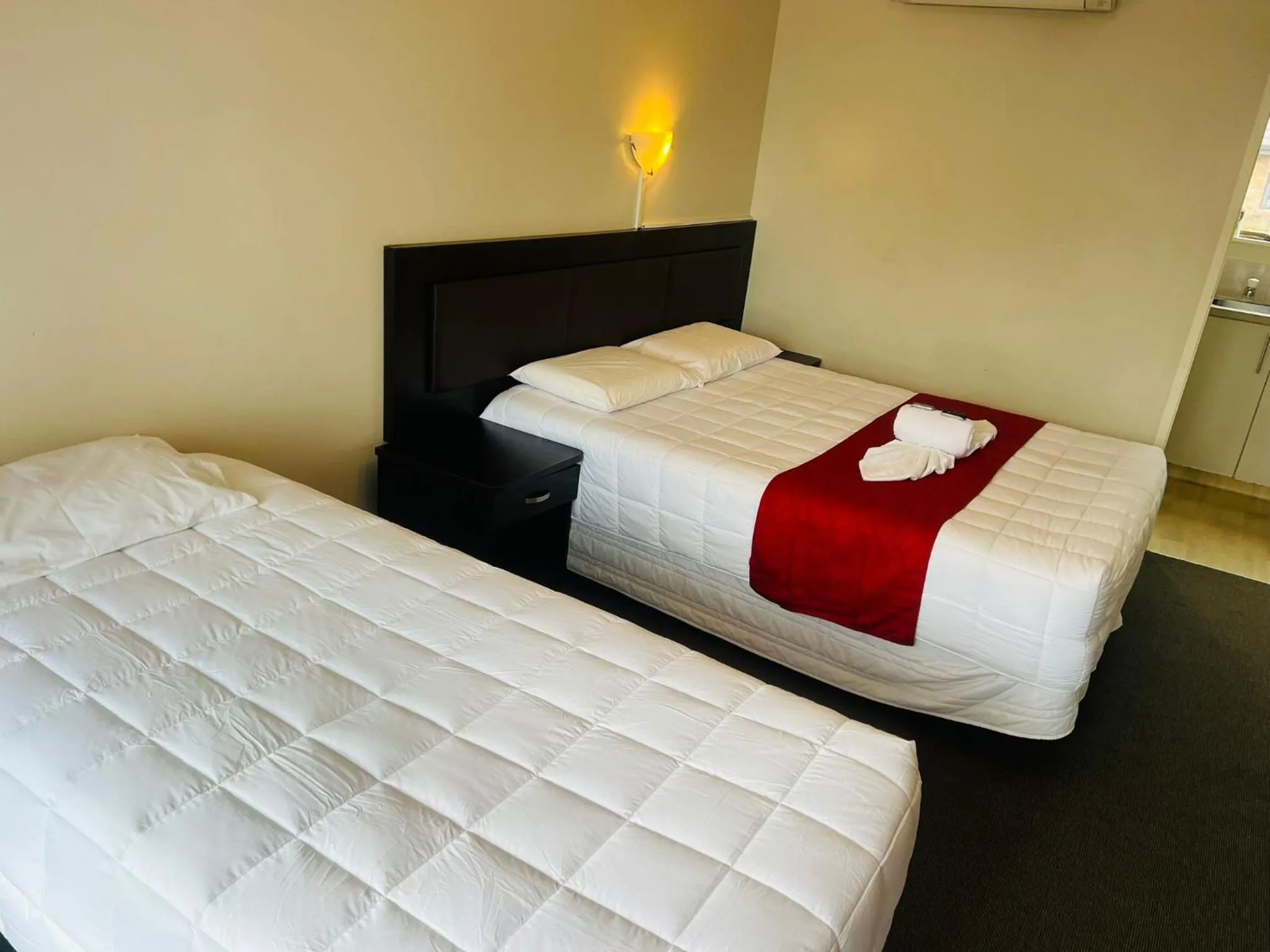 Bed in Monument Motor Lodge Papakura