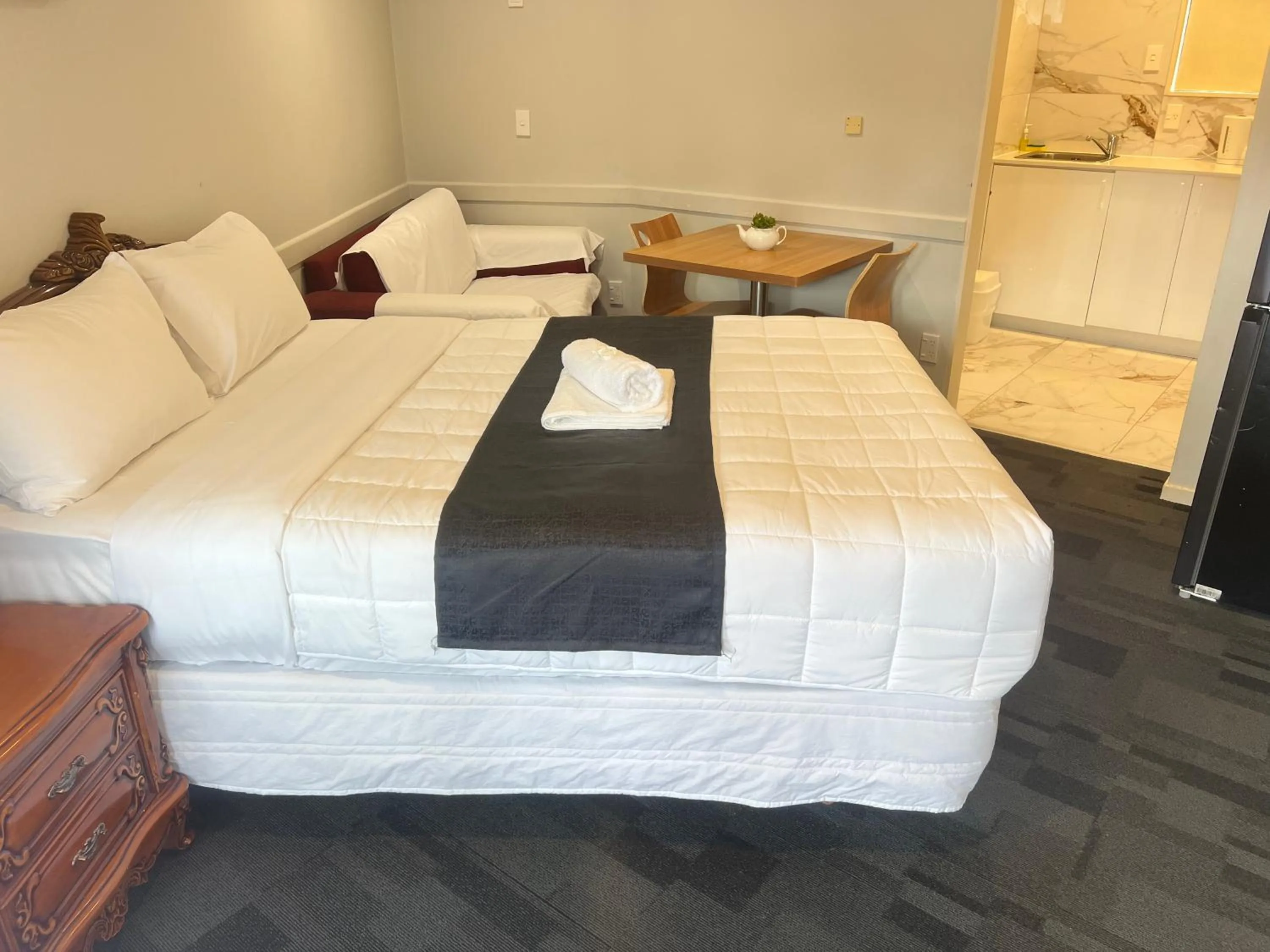 Bed in Monument Motor Lodge Papakura