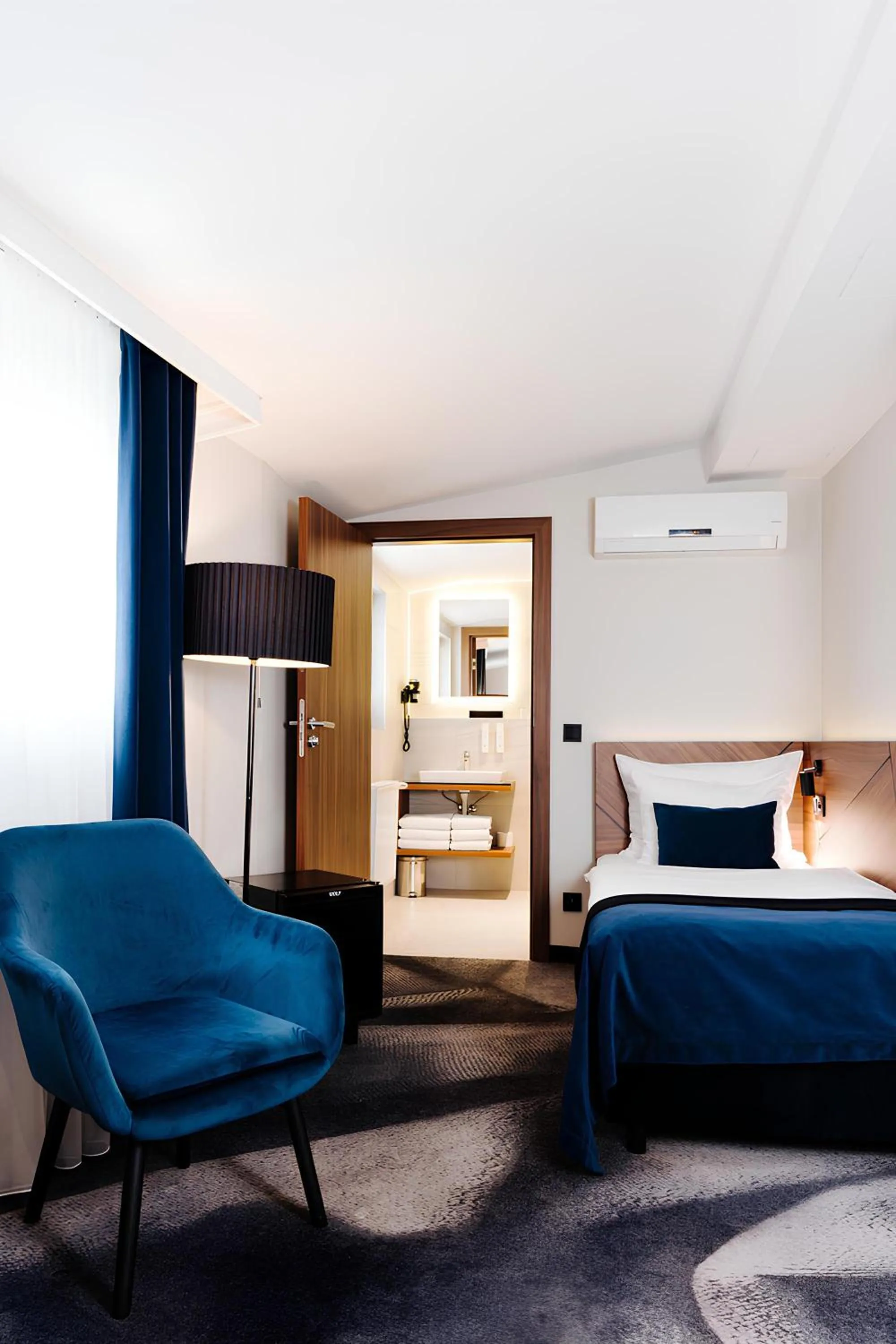 Bed in Ascot Premium Hotel