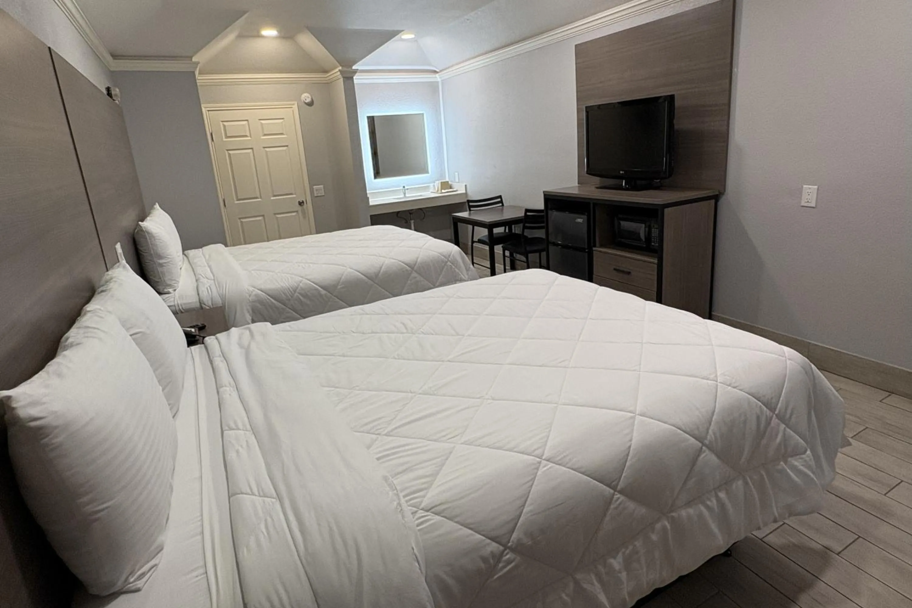 Bedroom, Bed in Kiwi Inn Capital O Houston - Hwy 249