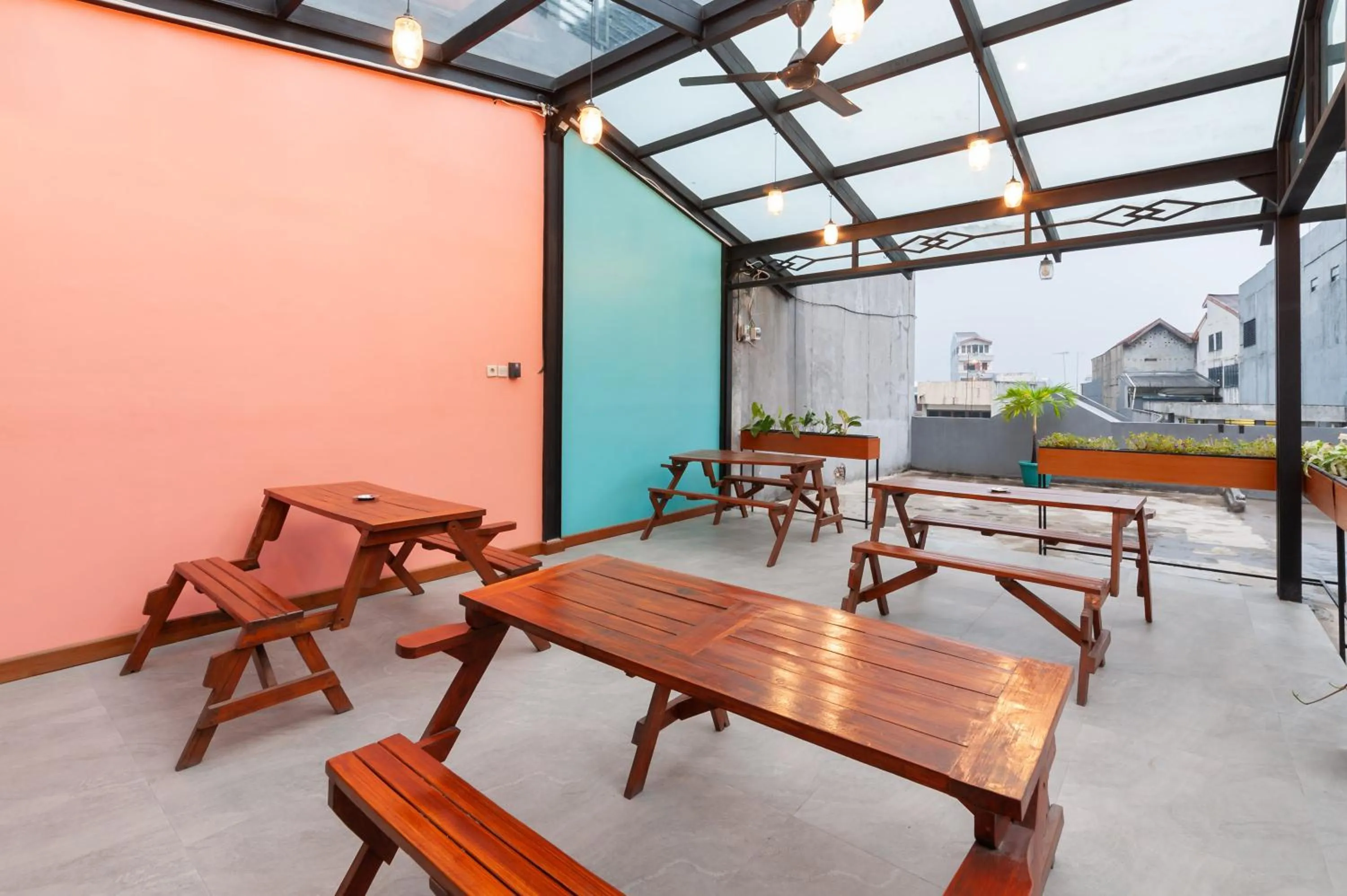 Seating area in Sans Hotel Suryakencana Bogor