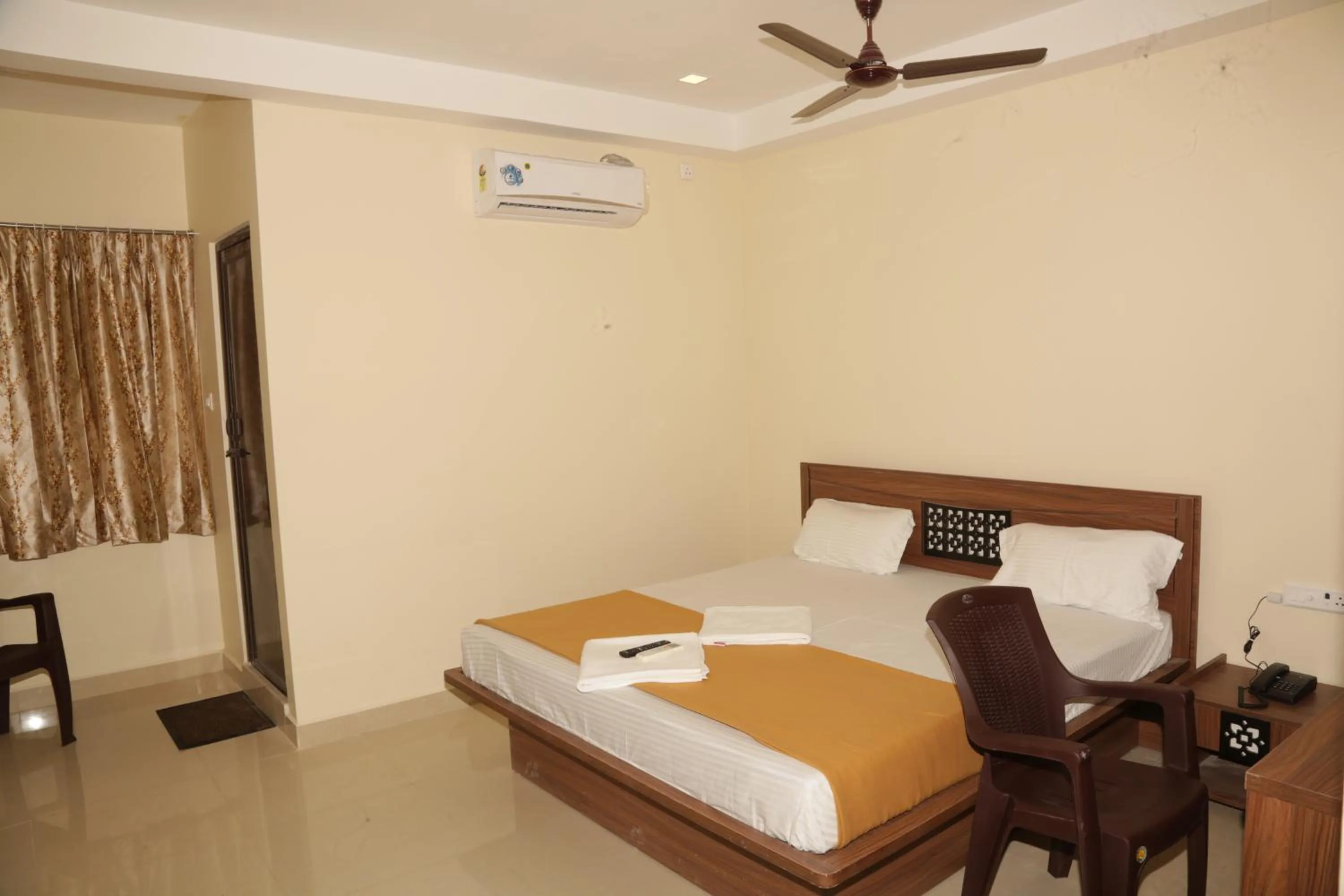 Photo of the whole room, Bed in Santhosh Inn