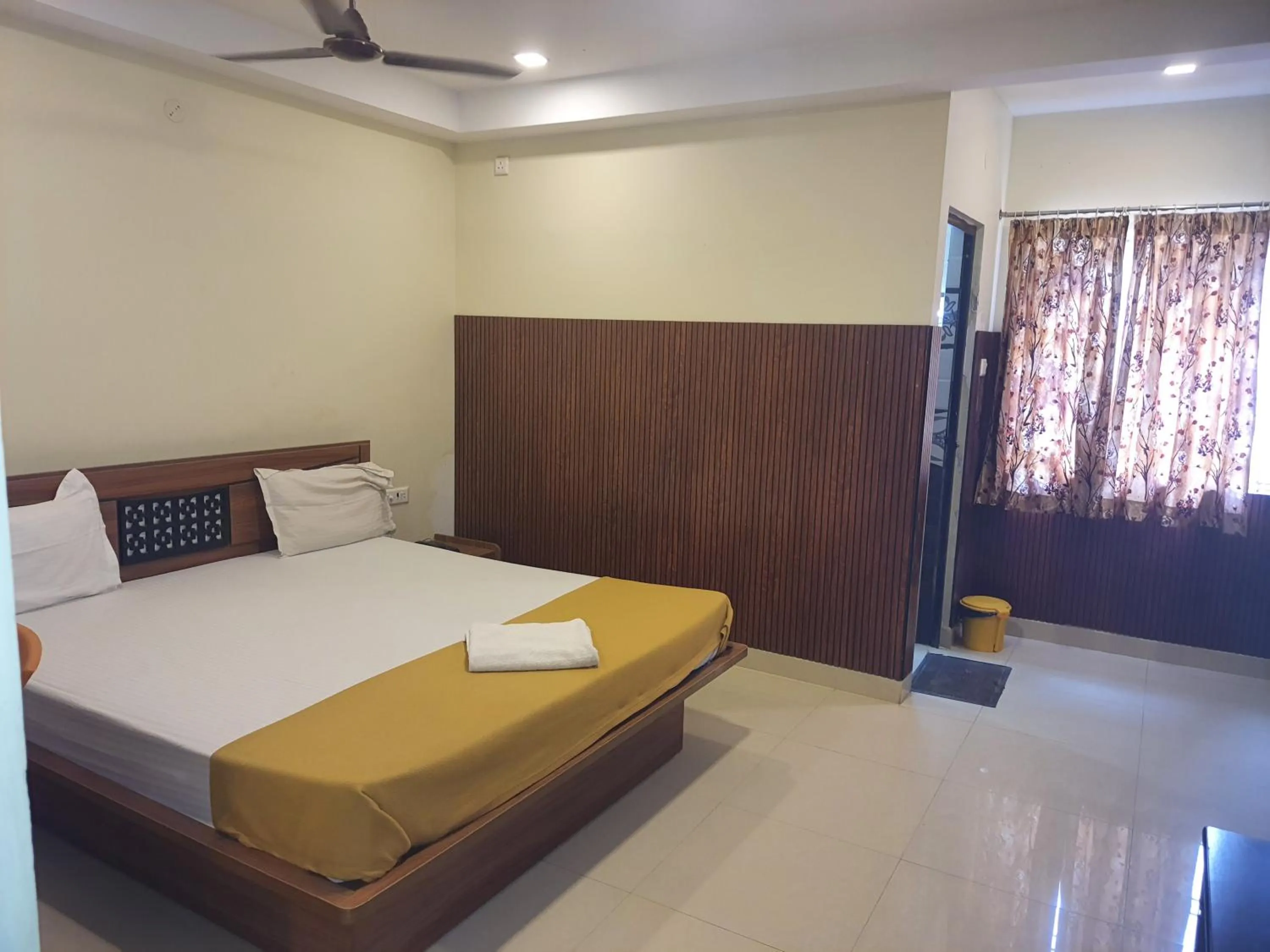 Bed in Santhosh Inn
