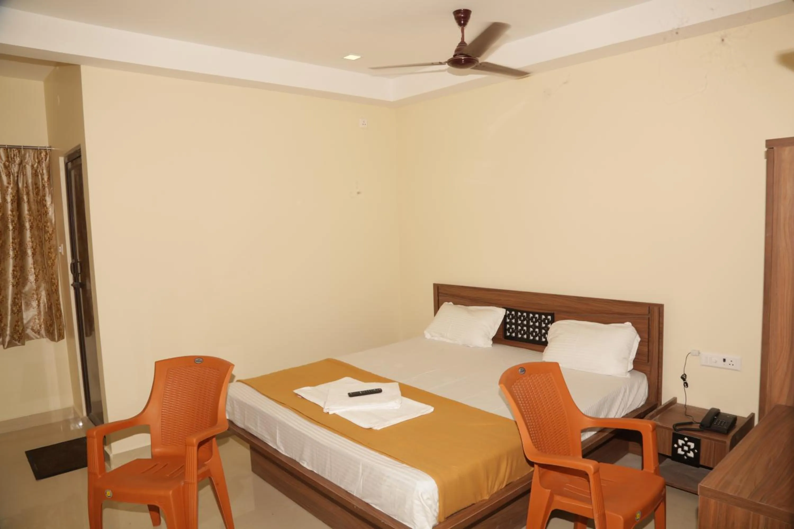 Photo of the whole room, Bed in Santhosh Inn